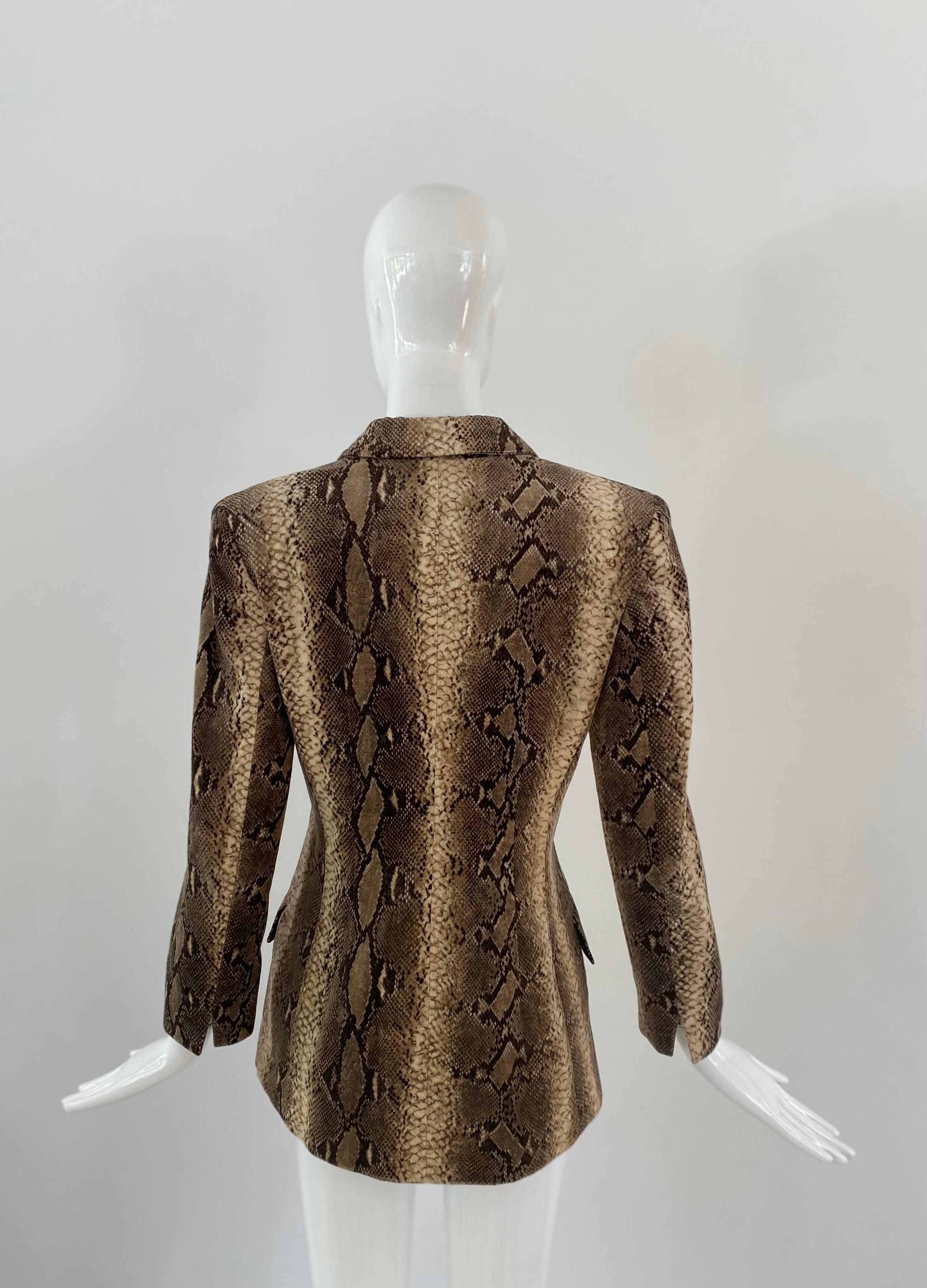 1990s Valentino  'Miss V' velvet blazer in a lush snakeskin print of browns and tan color with six tortoiseshell and gold buttons. This jackets adds a little edge while being essentially a neutral. 

Slim and long fit. Fully lined and two external