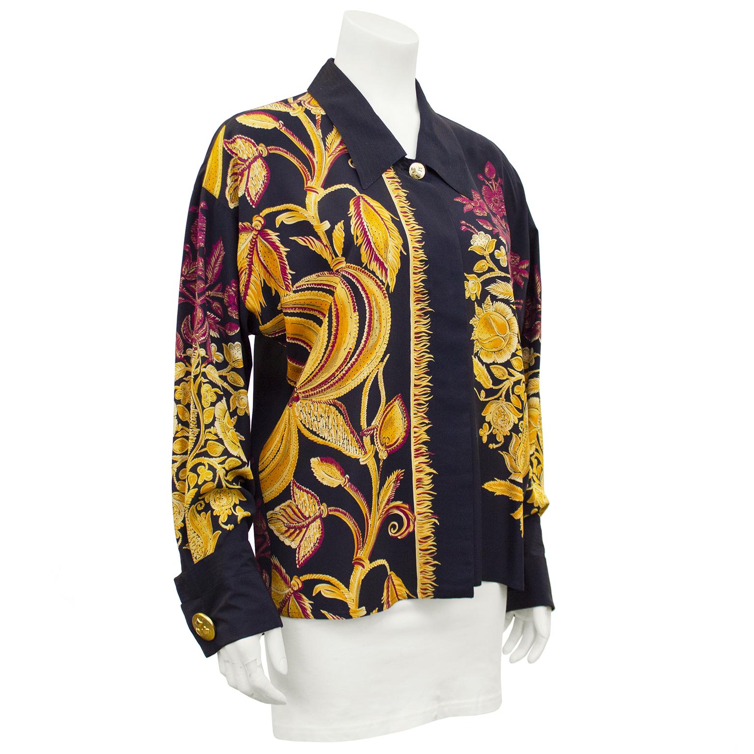 Gianni Versace Couture black label silk shirt from the early 1990s. Black with large gold and maroon baroque style botanical print. Large gold tone button at neck and cuffs, all featuring a diamond, spade and club. Excellent vintage condition, fits