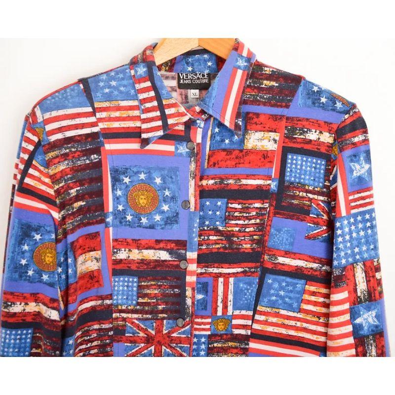 Early 1990s 'Versace Jeans Couture' fitted, long sleeve shirt, with the US & Union Jack flags as well as the Versace Medusa logo patterned decoration throughout.
The Material is a soft, stretchy cotton fabric. 

Features:
Central line press stud