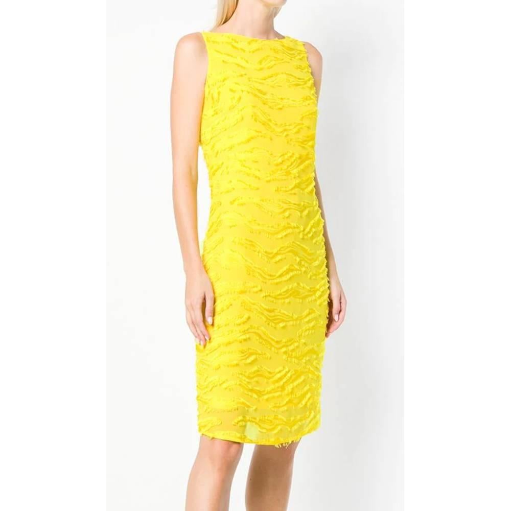 Versace textured yellow sleeveless slim dress. Boat neckline and back V-neckline, concealed zip fastening on the back. Knee length.

Size: 44 IT

Linear measures
Height: 87 cm
Bust: 48 cm 
Waist: 40 cm 
Hip: 46 cm

Product code: A5096

Composition: