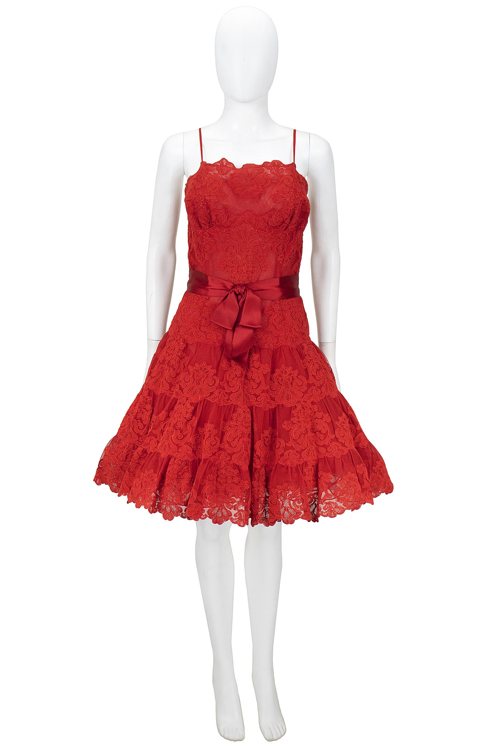 Vicky Tiel Couture cocktail dress
Red lace with tulle underskirt 
Red ribbon bow at the waist 
Back zipper and hook and eye closure 
Made in Paris

*Please feel free to contact us with the 
