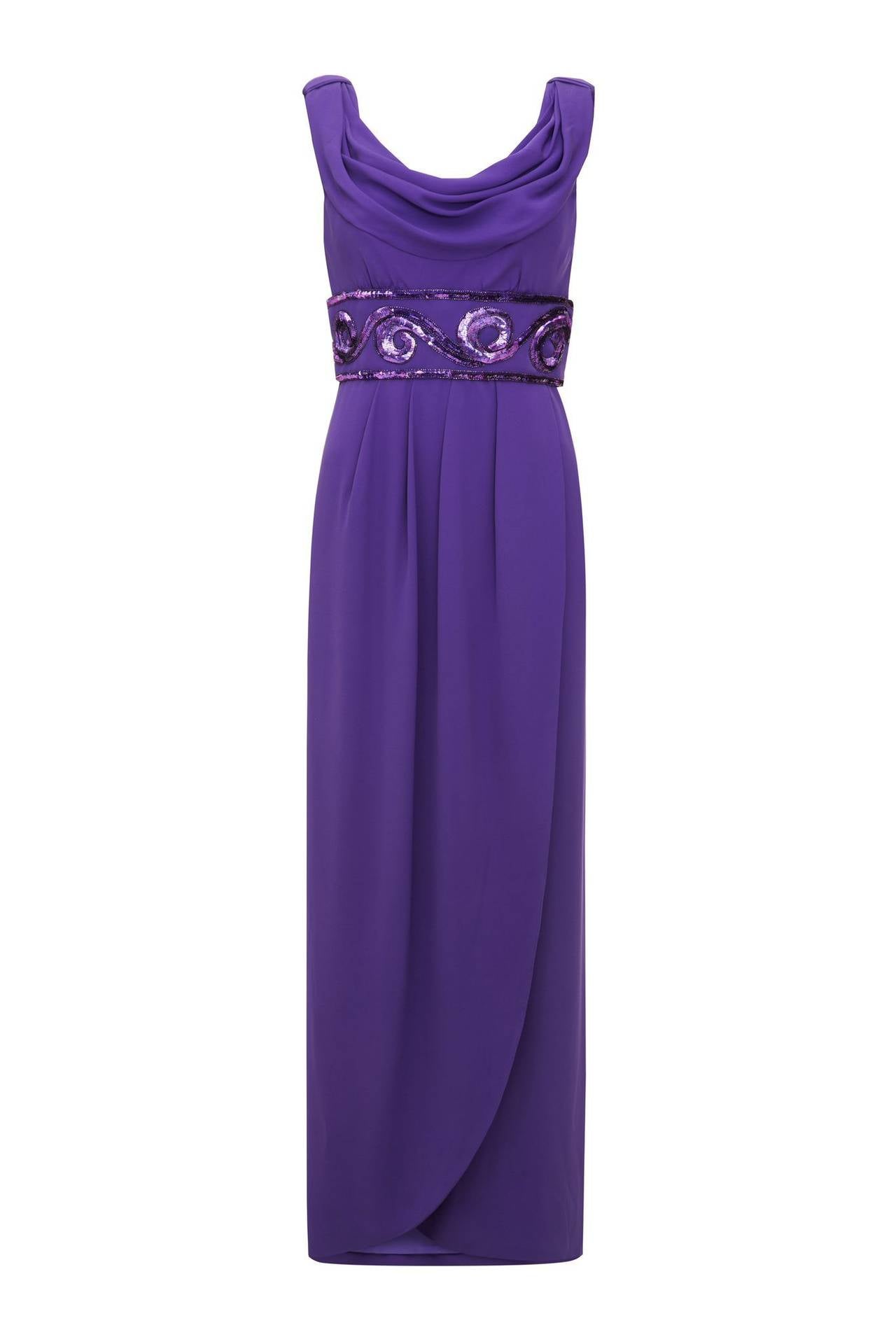 This striking early 1990s Grecian style purple silk evening dress is couture by designer Victor Edelstein, who is best known for dressing Princess Diana during her zenith as a global fashion icon. This piece is exquisitely constructed with internal