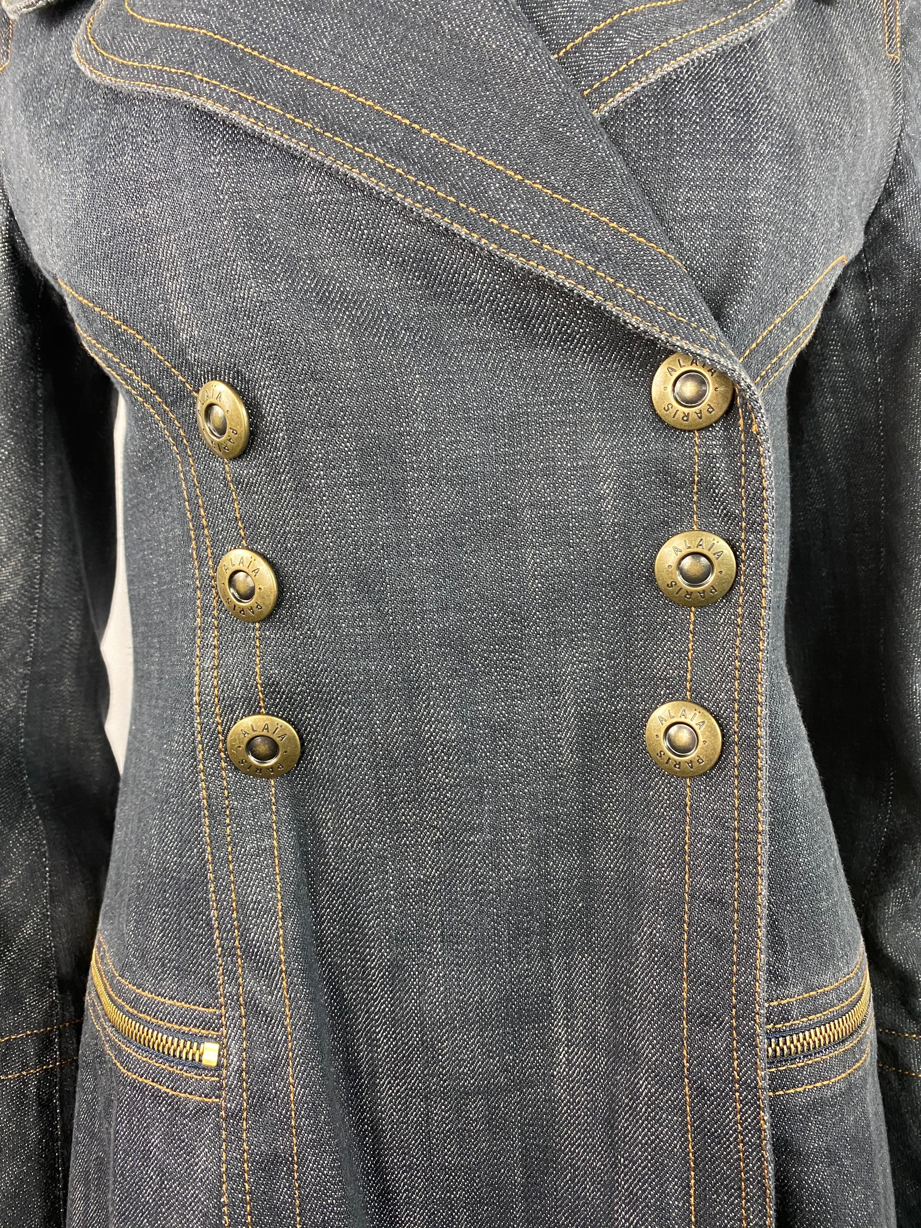Product details:
Circa 1990's
Size medium
Featuring 100% cotton dark blue denim, mid length coat with gold tone hardware, front click in buttons closure, dial zip pockets.
Made in France.