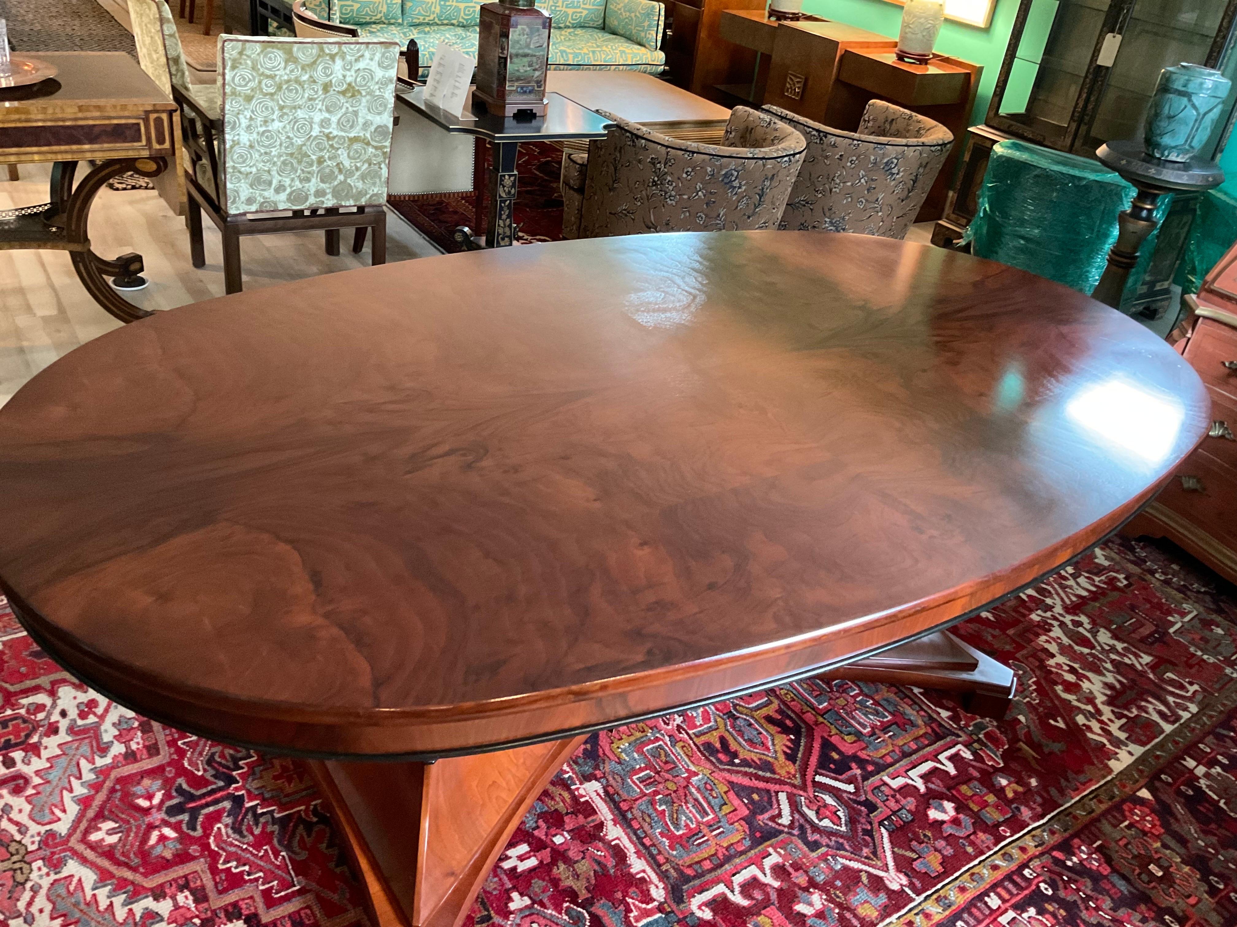 Beautiful Cherry Biedermeier Style Double Pedestal Oval Dining Table. The pedestal bases are massive and magnificent.

Condition Disclosure:
Please understand nearly all of our inventory is comprised of rare to very rare vintage pieces. They are not