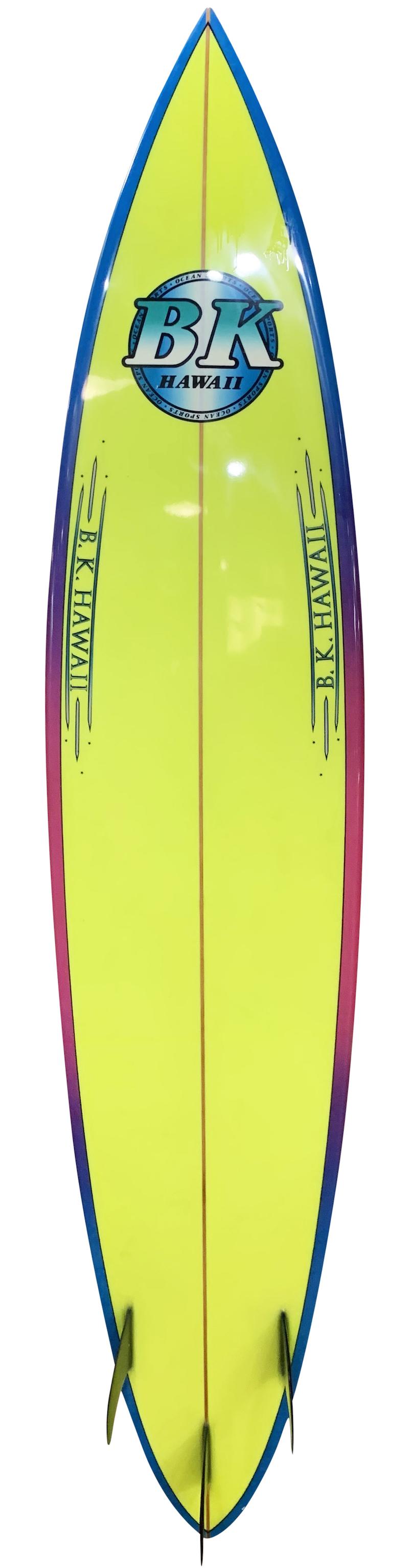Early 1990s vintage BK Hawaii big wave gun surfboard shaped by Barry Kanaiaupuni in the early 1990s. Featuring a vibrant airbrush design and thruster fin setup. Restored to original condition.

Barry Kanaiaupuni is best known for his dominance at