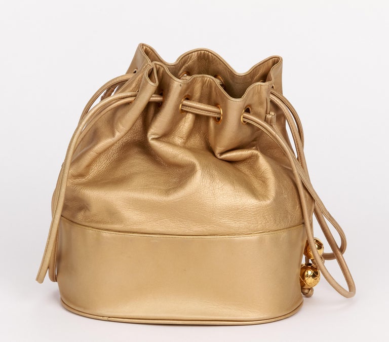 CHANEL 1989-1991 Gold Lambskin Drawstring Bucket Bag – AMORE Vintage Tokyo