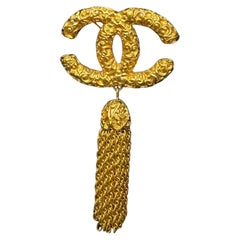 1990s Vintage CHANEL Gold Toned CC Tassel Brooch