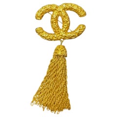 1990s Vintage CHANEL Gold Toned CC Tassel Brooch