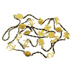 1990s Vintage CHANEL Gold Toned Long Chain Necklace CC No.5 Camellia Lion Clover