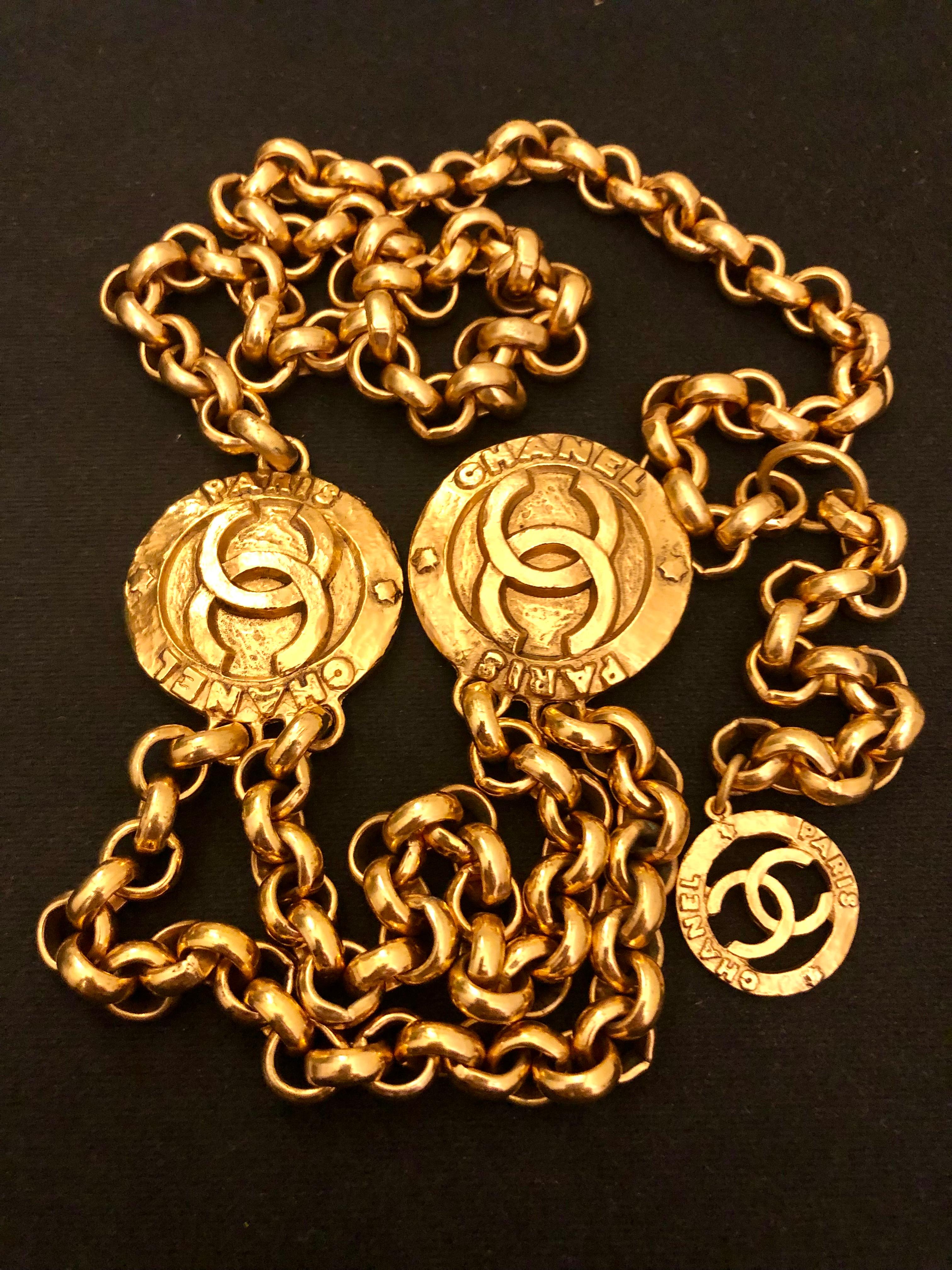 This vintage CHANEL chain belt is crafted of gold toned sturdy double chains featuring two large CC medallions and a small CC medallion charm. Hook fastening closure. Measures approximately 90 cm including medallions and medallions measure 4 cm and