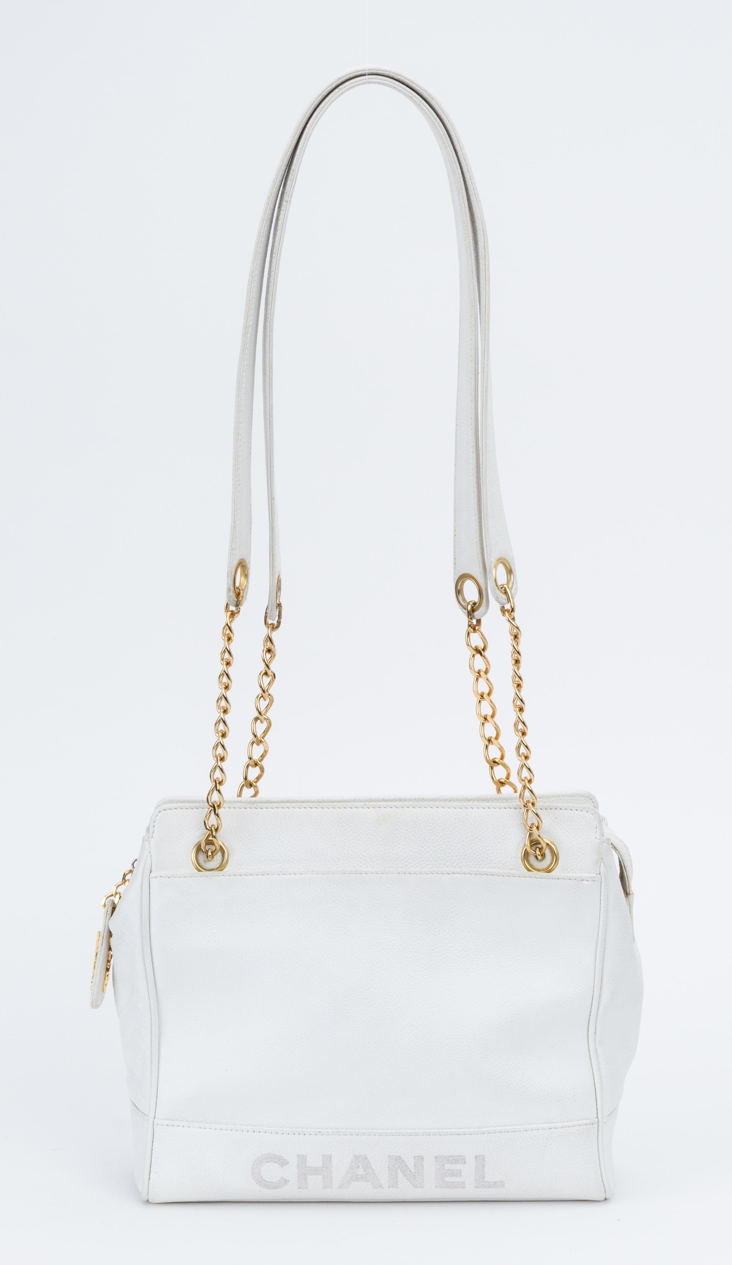 Chanel white caviar leather 90s shoulder bag with gold tone hardware. Excellent exterior. Shoulder drop 16