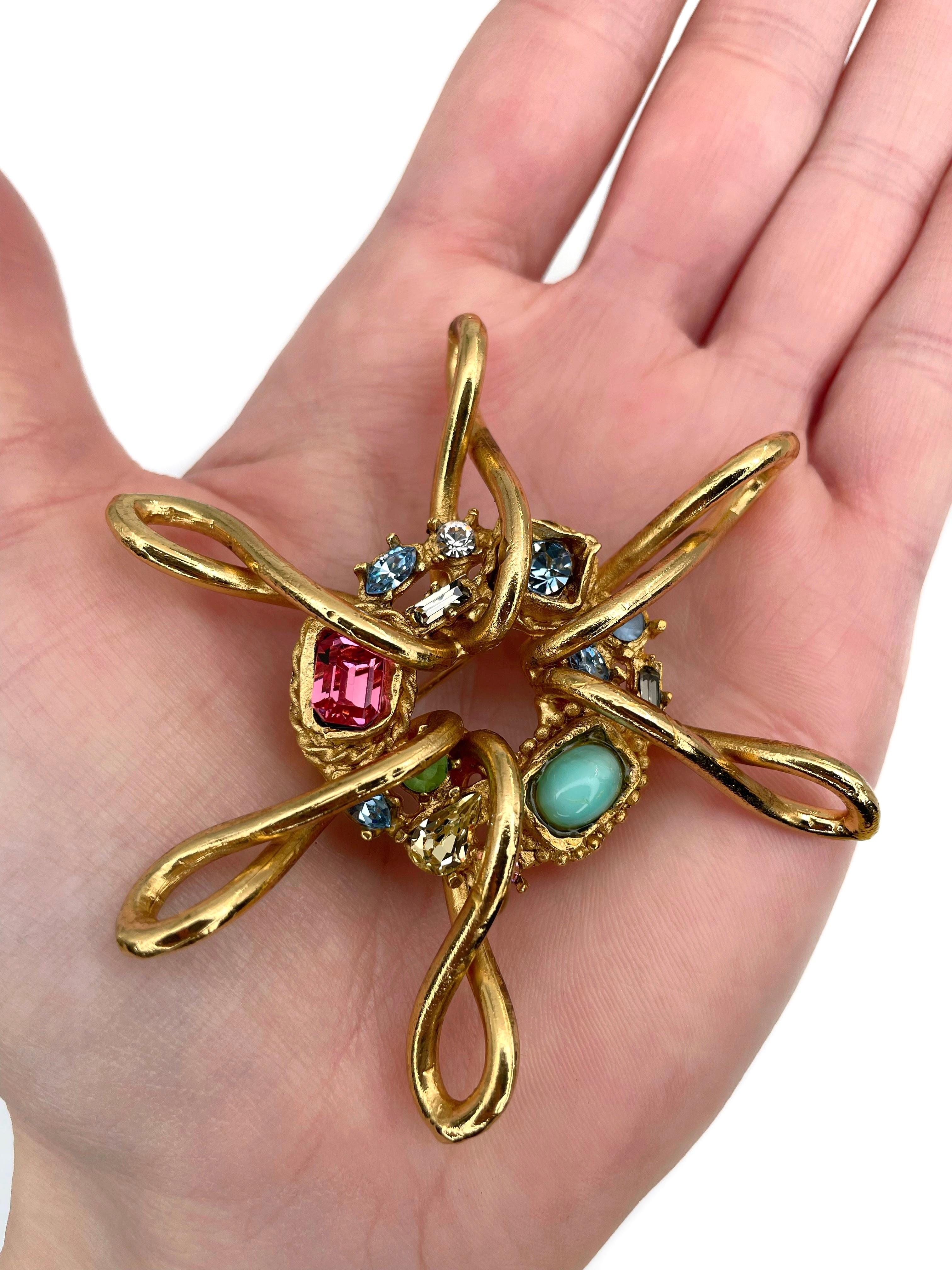 This is a rare sun shape pin brooch designed by Christian Lacroix in 1990’s. 

The piece is gold plated. It features colourful rhinestones and resin. 

Has a safe clasp.
Signed: “CL - Made in France”.

Diameter: 7cm

IMPORTANT: As a buyer, you are