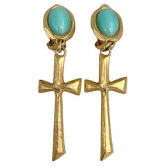 1990s Retro Christian Lacroix Gold Tone Faux Turquoise Cross Clip On Earrings