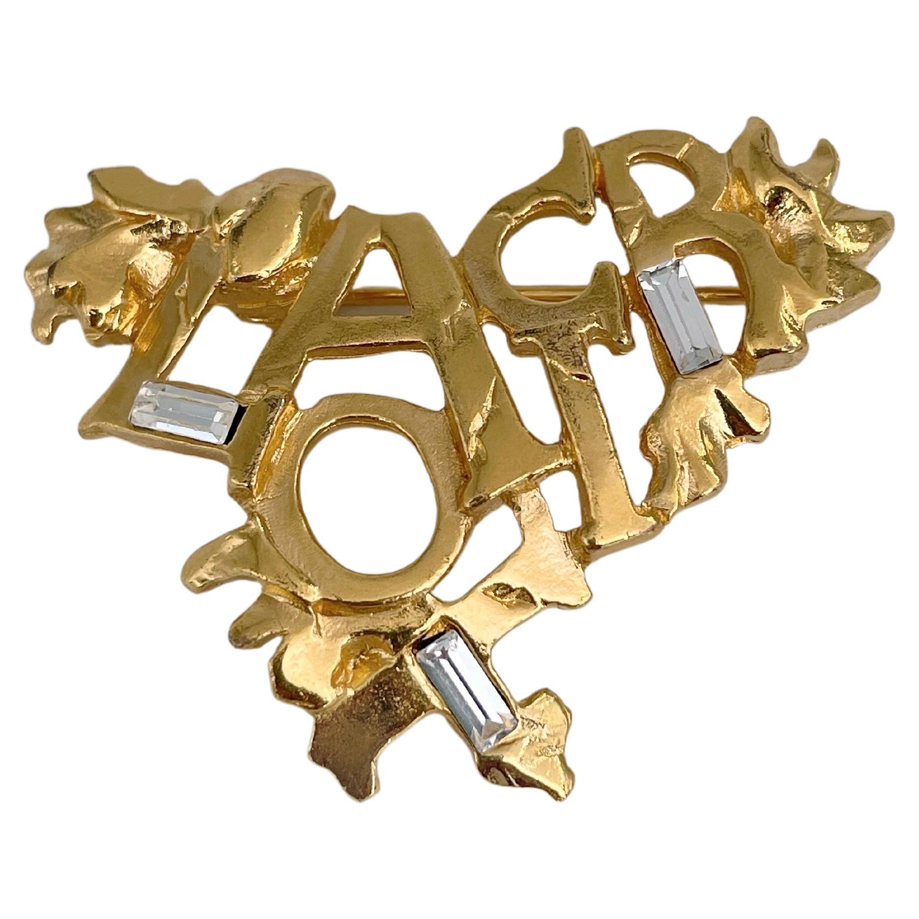 1990s Vintage Christian Lacroix Gold Tone Openwork Logo Heart Pin Brooch For Sale