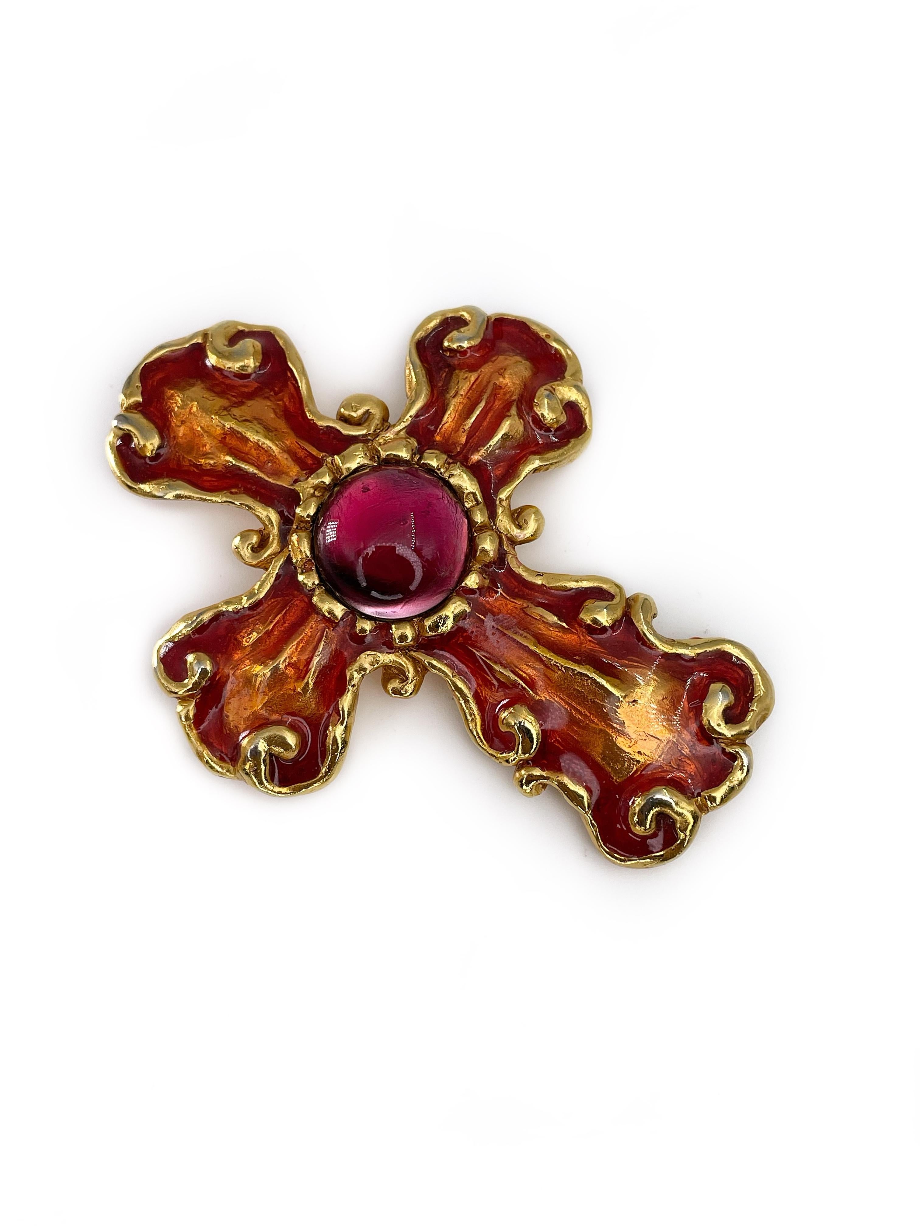 This is a magnificent gold tone Baroque cross brooch pendant designed by Christian Lacroix in 1990’s. The piece is gold plated, adorned with orange enamel and cabochon cut red glass at the center. 

Signed: “Christian Lacroix - CL - Made in