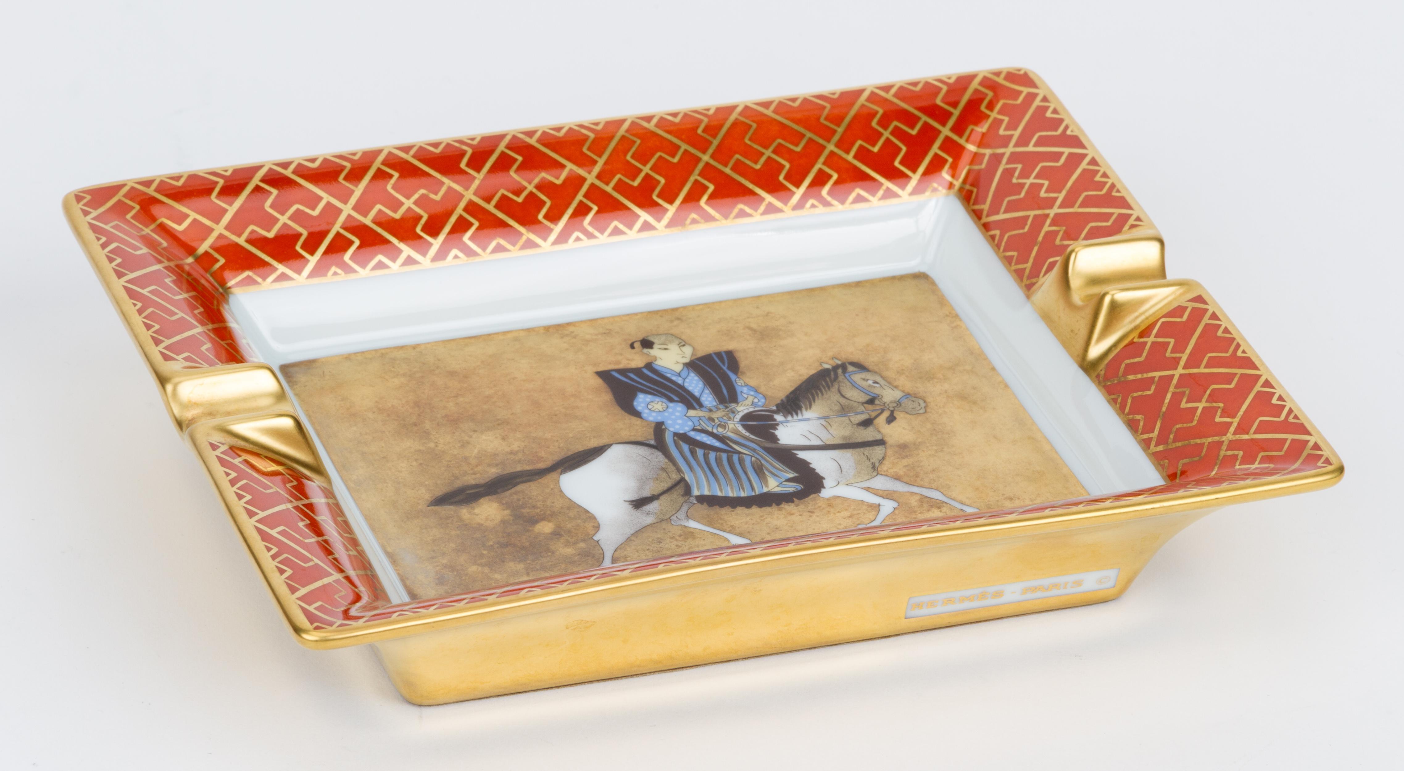 Hermès rare gold leaf and rust samurai on a horse vintage ashtray. Suede stamped with HHH in the back. Collectible.
