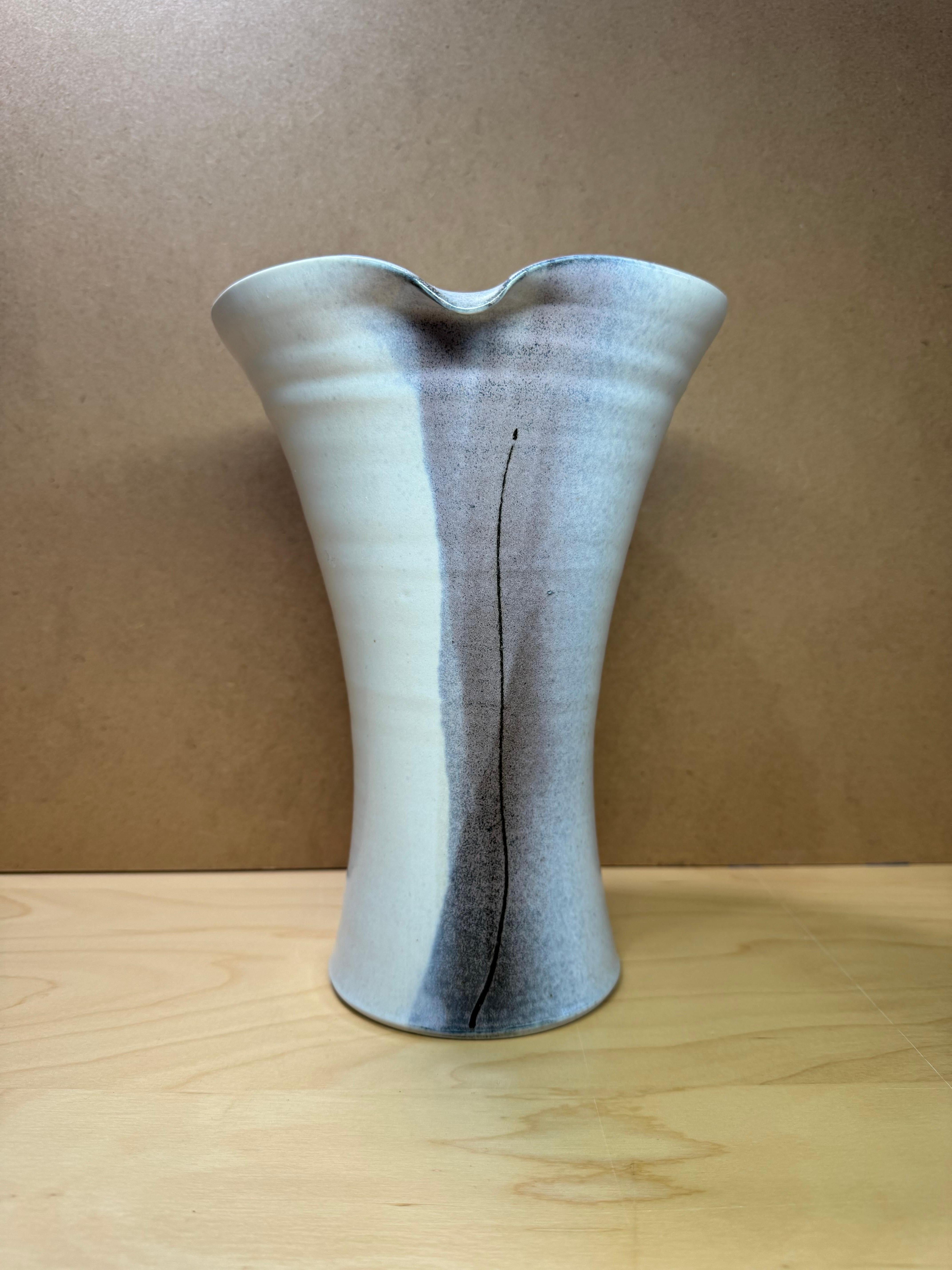 Gorgeous hand thrown studio pottery vase in an off white color with accents of different shades of brown and finished off with a subtle black line. 

This vase is signed on the bottom by the artist; Dan Flat.

The vase is in excellent condition. It