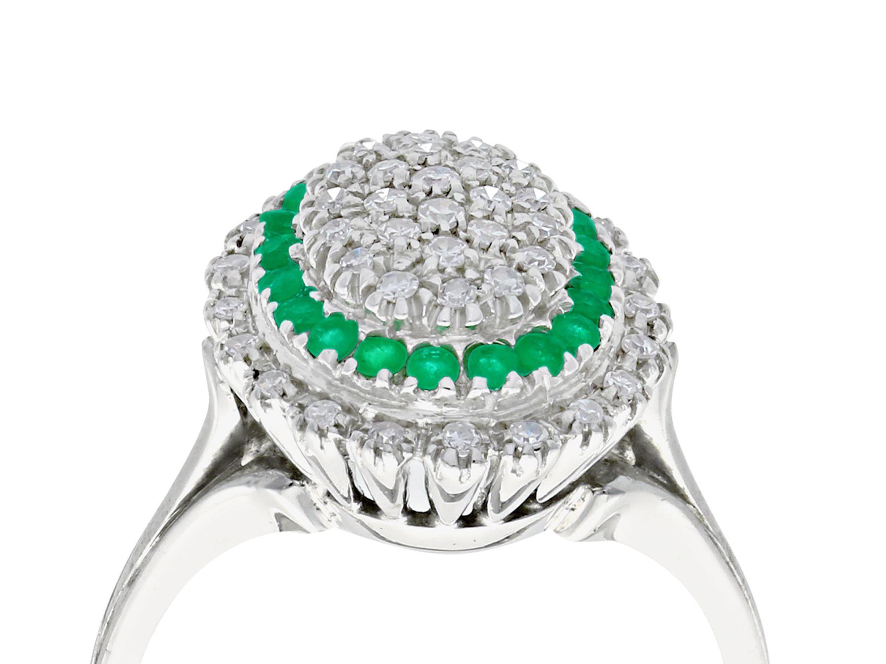 A fine and impressive vintage 0.31 carat natural emerald and 0.72 carat diamond dress ring in 18 karat white gold; part of our diverse range of gemstone jewelry

This impressive pavé set diamond and emerald dress ring has been crafted in 18k white
