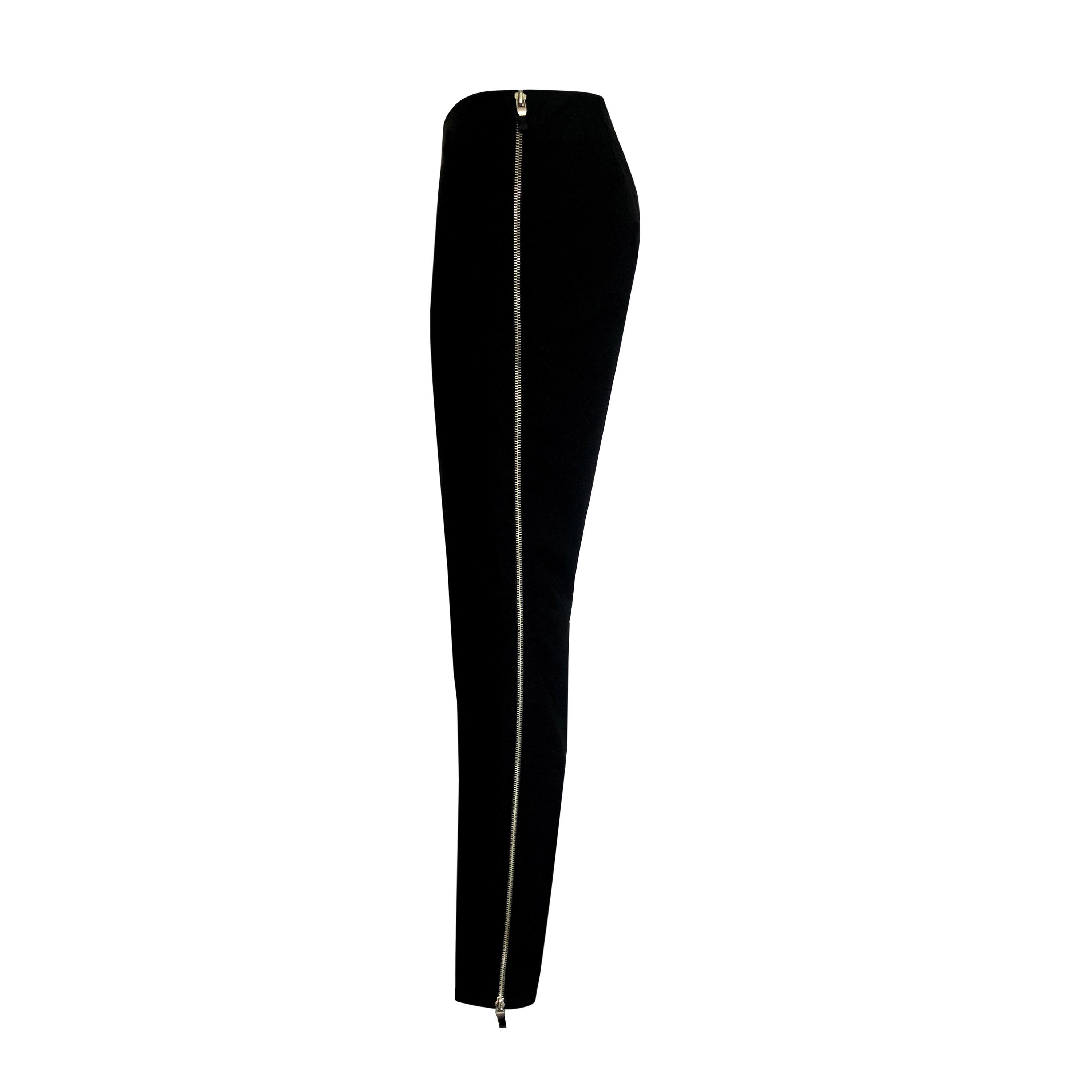 Product Details: 1990s Vintage - Fitted Side Zip Trousers - Double Ended Silver Side Zip Detail / Both Side Seams - Black Stretch Nylon + Lycra Mix
Era: 1990s Vintage
Label: Cache
Size: 2 (Fits UK 10)
Fabric Content: Black Stretch Nylon + Lycra