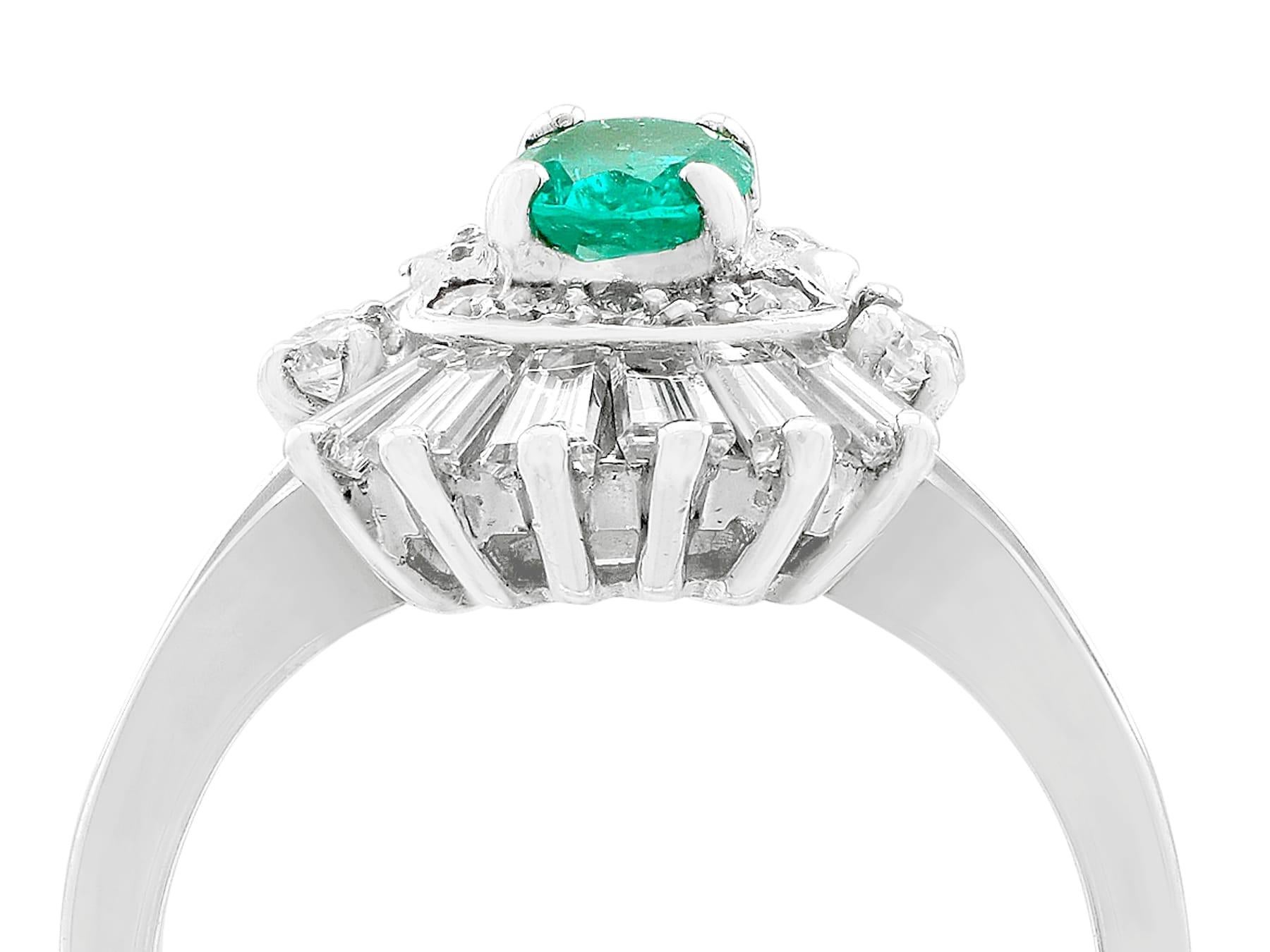 An impressive vintage French 0.45 carat emerald and 0.95 carat diamond, 18 karat white gold dress ring; part of our diverse antique jewelry and estate jewelry collections.

This fine and impressive antique emerald and diamond dress ring has been