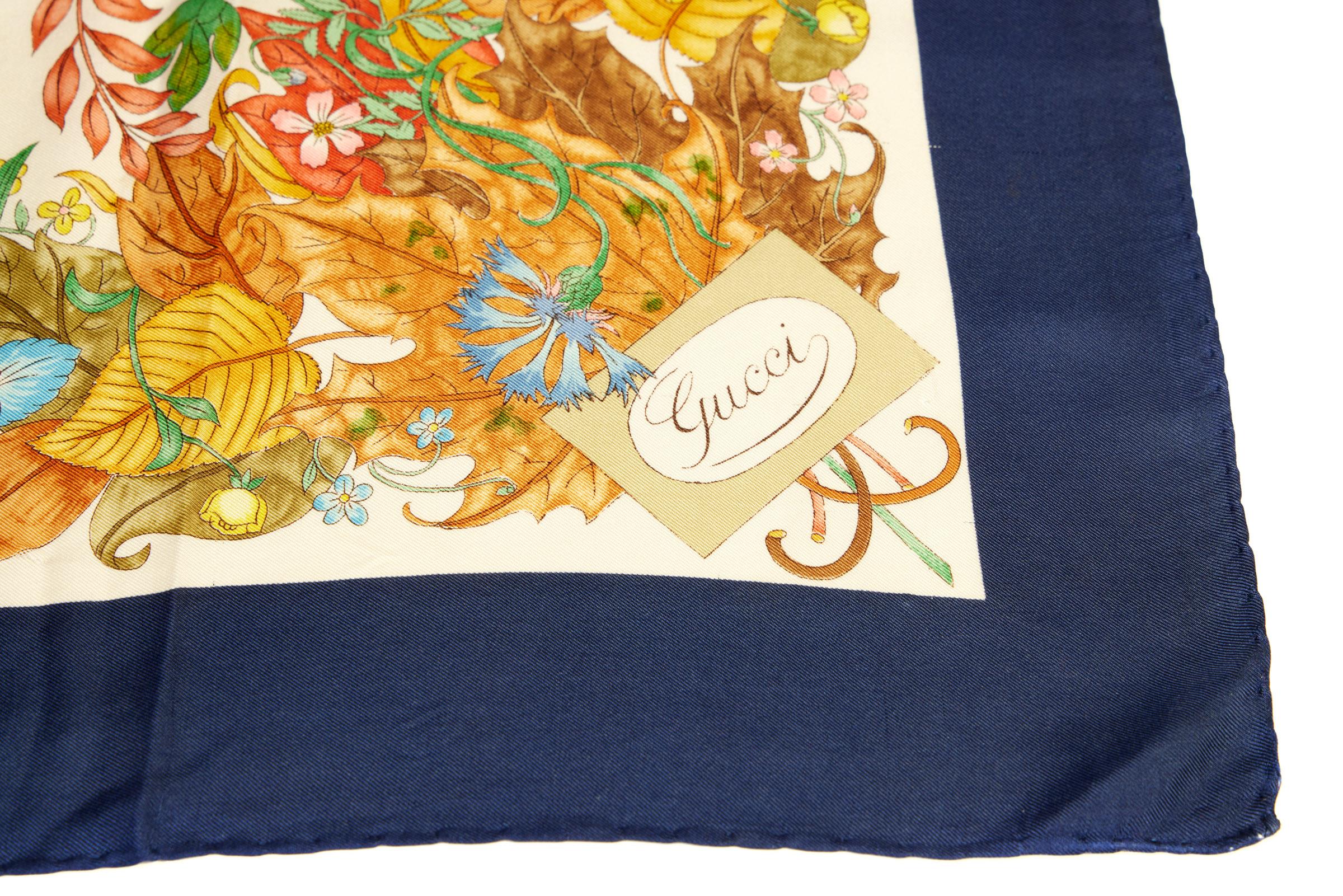 Gucci collectible Accornero flower silk scarf, blue trim.Minor stains, please refer to photos. Hand rolled edges.