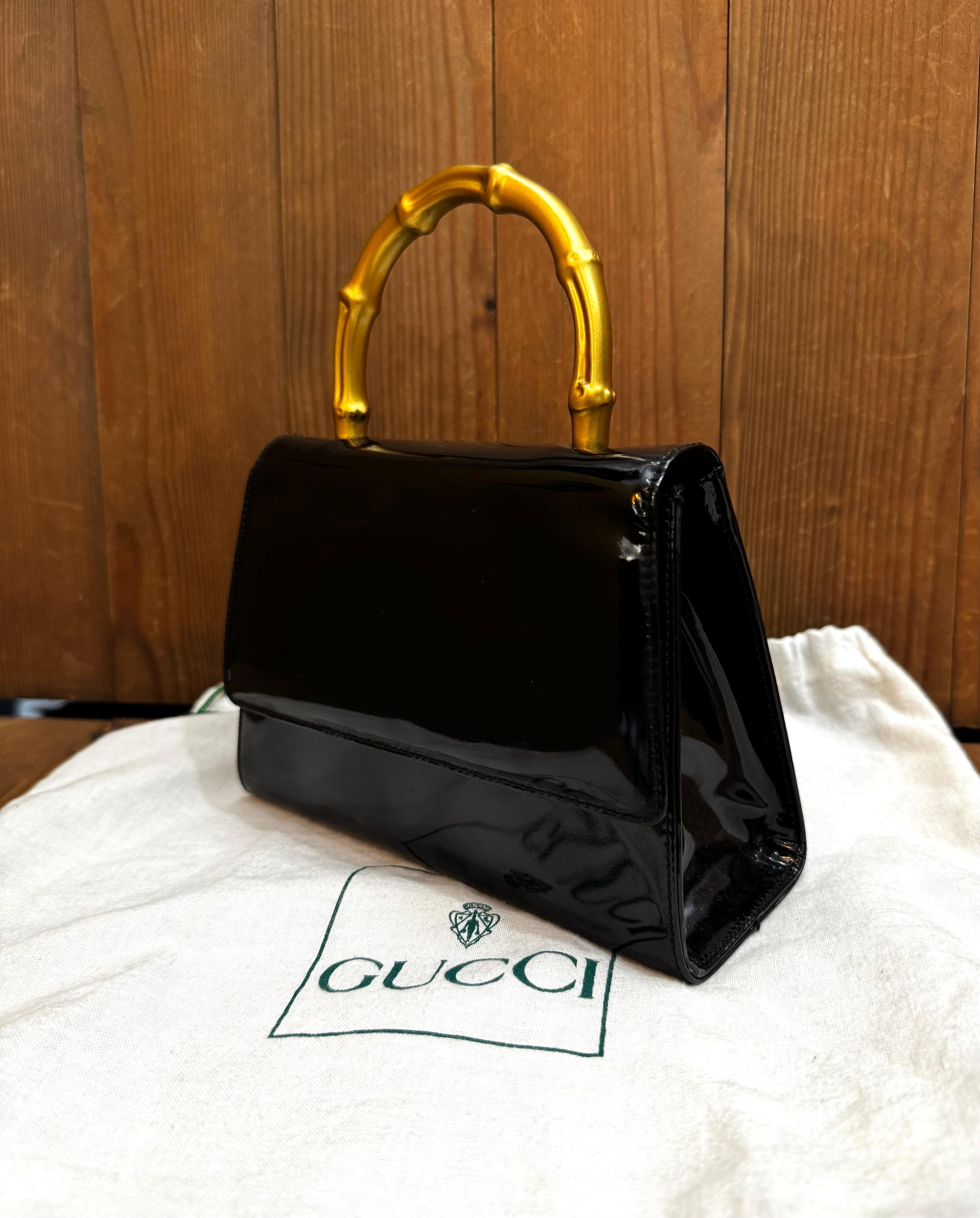 Women's or Men's 1990s Vintage GUCCI Mini Gold Bamboo Ring Hand Bag Patent Leather Black
