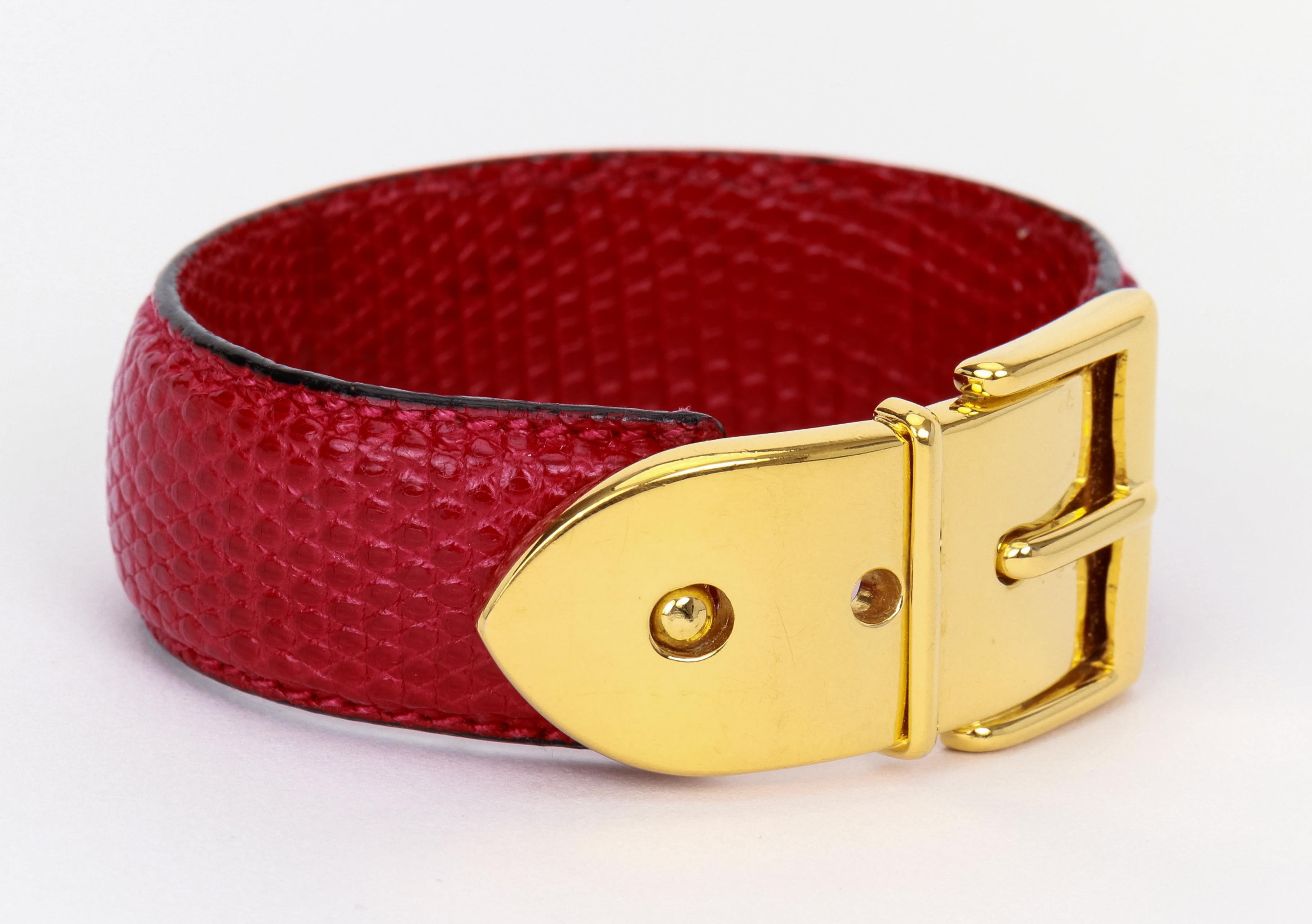 Gucci vintage red lizard and gold vintage hinged cuff , fits small and medium wrist. Comes with original box and velvet pouch