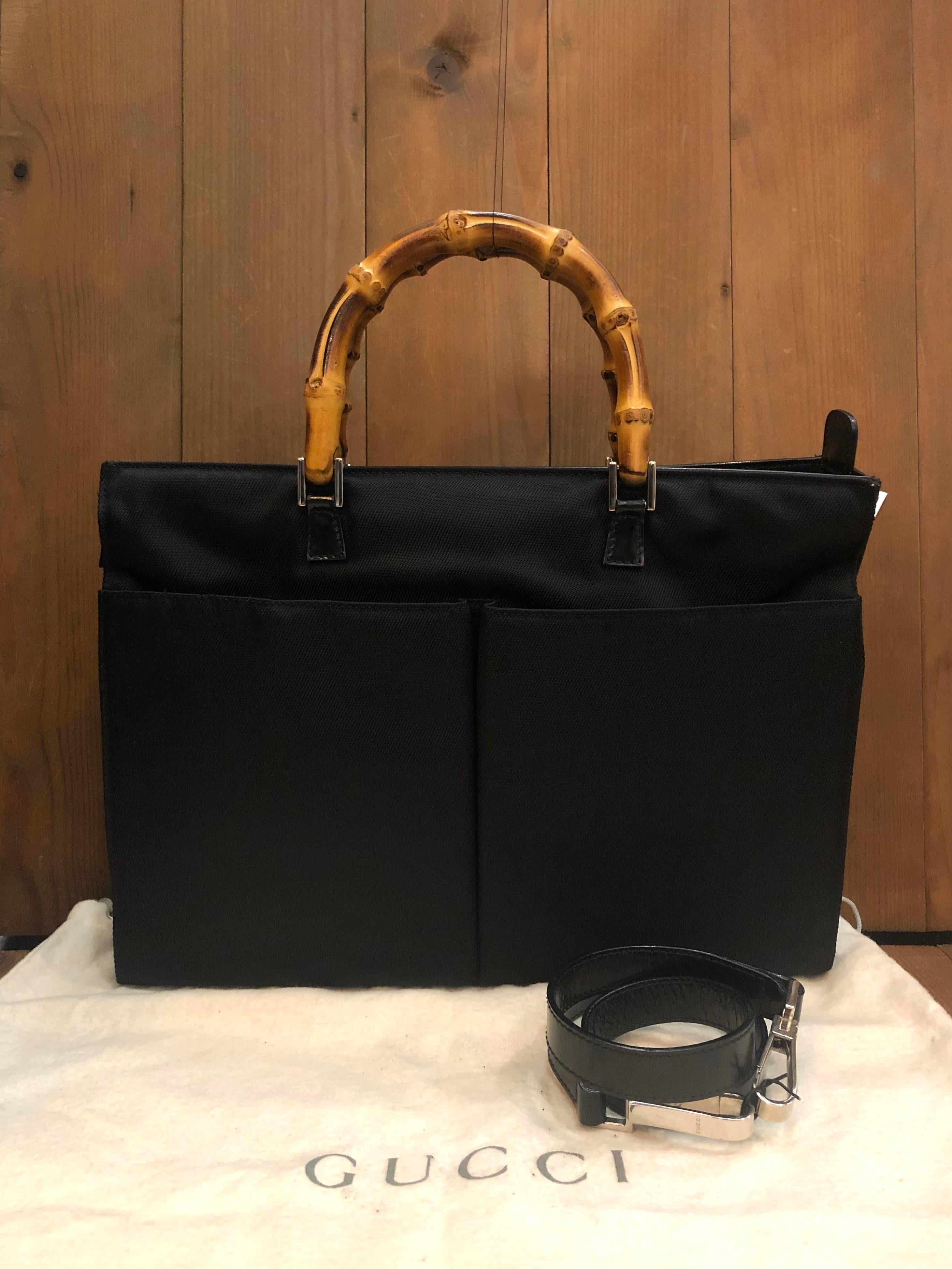 This vintage GUCCI Mini bamboo briefcase handbag is crafted of nylon and smooth calfskin leather in black featuring silver toned hardware and bamboo handles. Top zipper closure opens to a black diamanté jacquard interior featuring a zippered pocket.