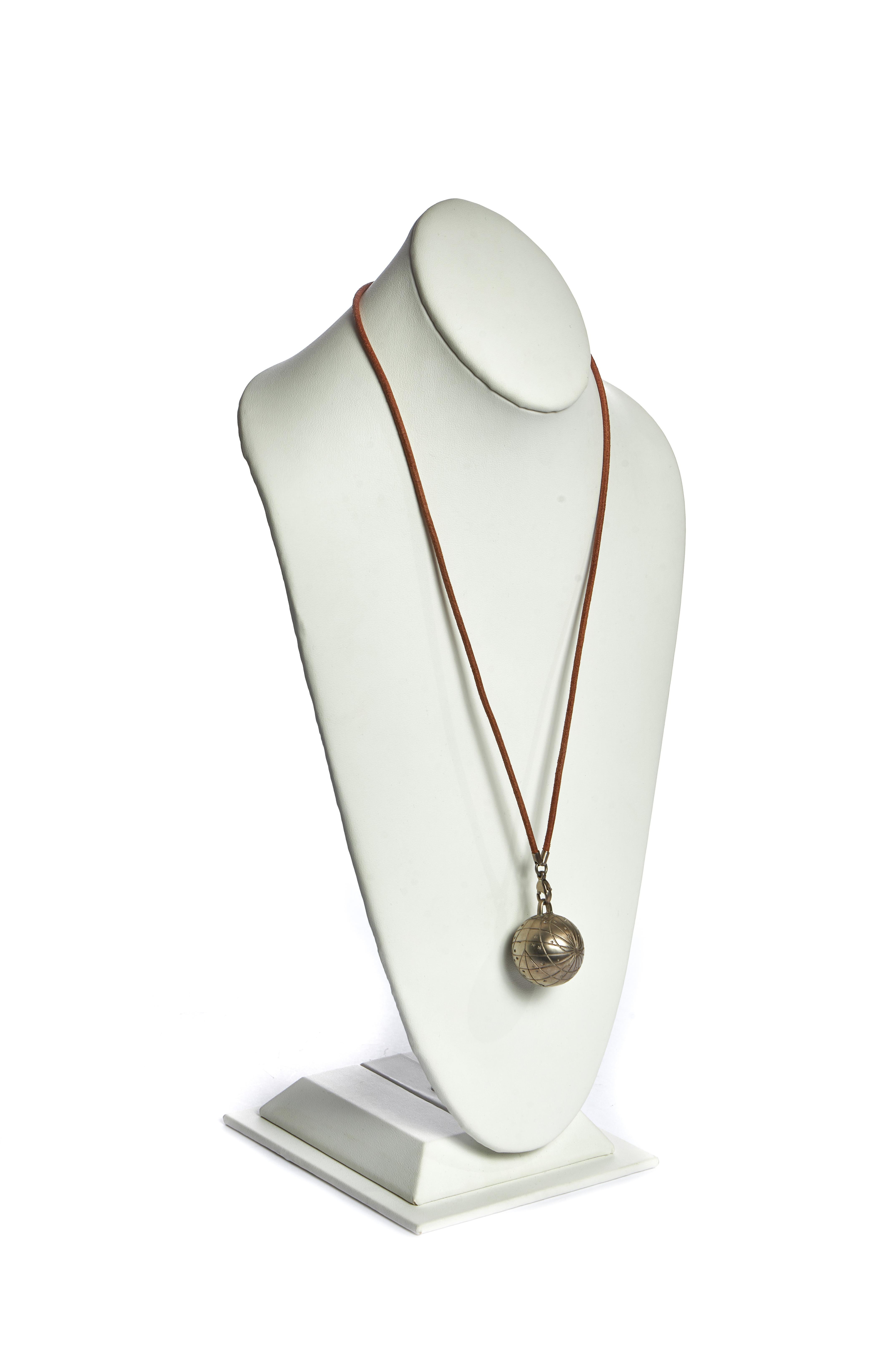Hermes globe silver tone necklace with natural leather strap. Pendant opens and is hollow. Comes with velvet pouch.