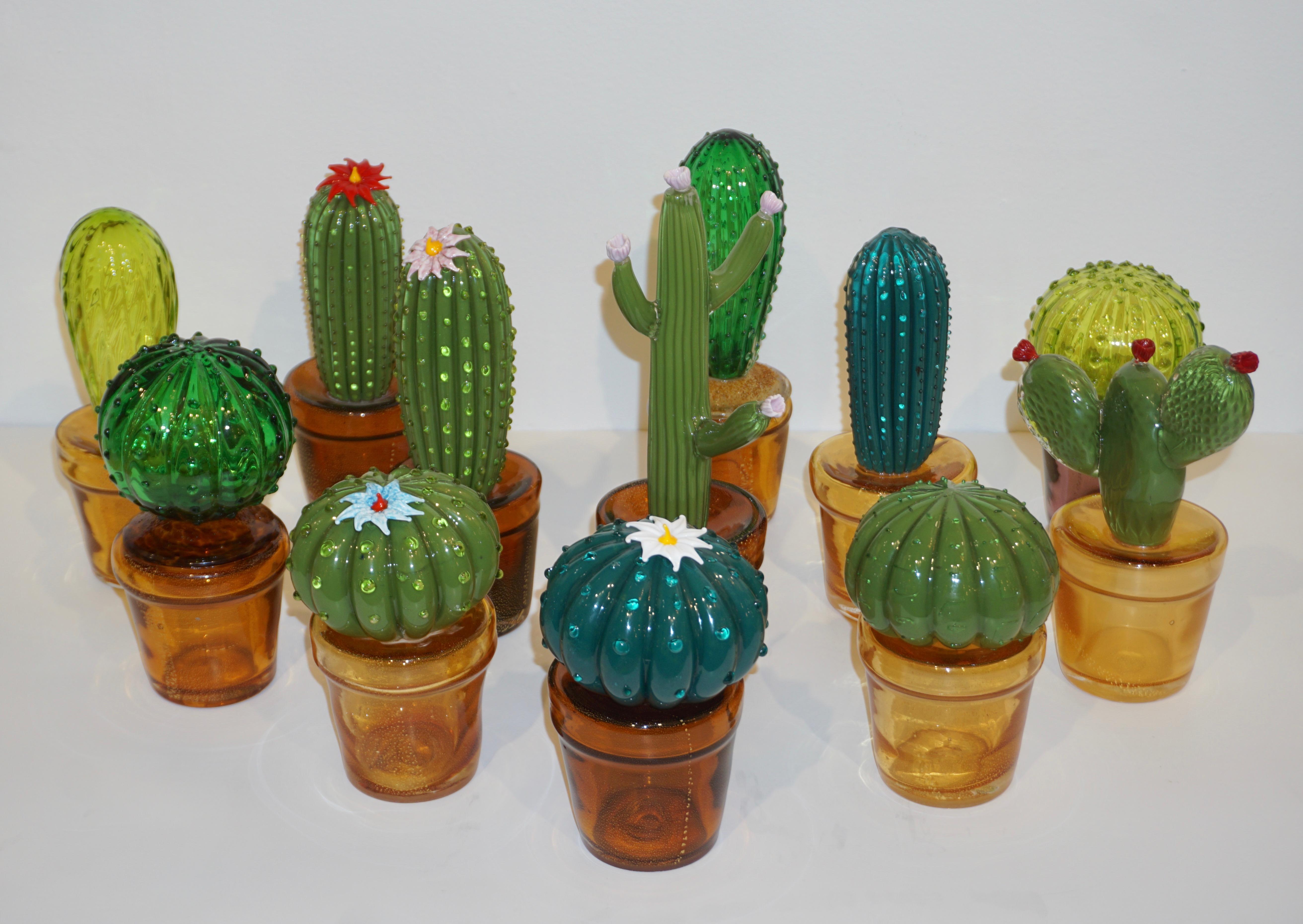 1990 Italian highly collectible blown glass cactus of limited edition by Formia, entirely handcrafted in Murano with modern Minimalist design, in a lifelike organic modernist shape in overlaid moss green Murano glass highlighted with prickles in