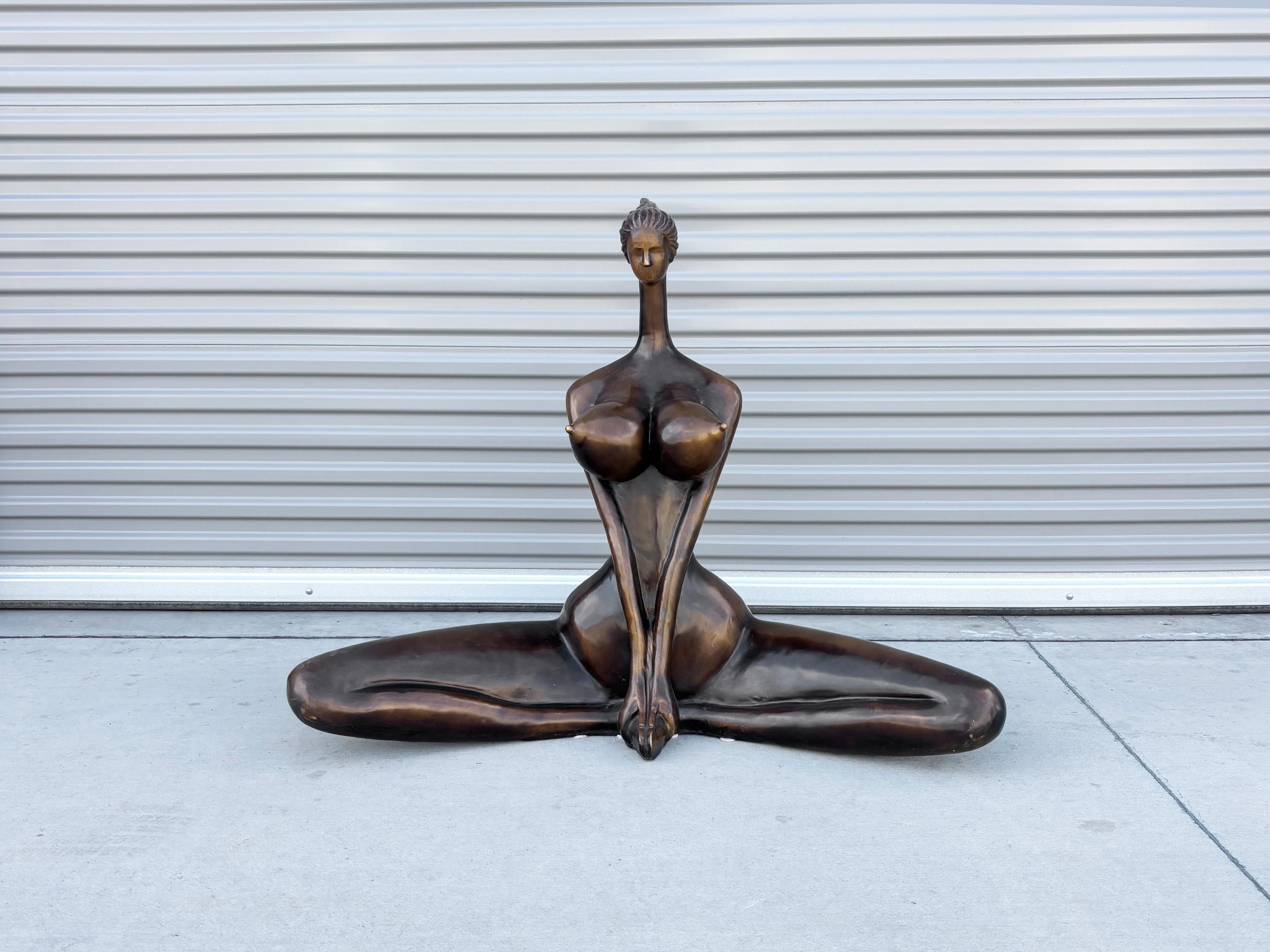 ✨ Monumental Bronze Seated Female Sculpture ✨

This striking bronze sculpture captures a stylized female figure in a serene seated pose, blending modernist abstraction with classical elegance. Crafted with smooth, flowing lines and a rich patinated