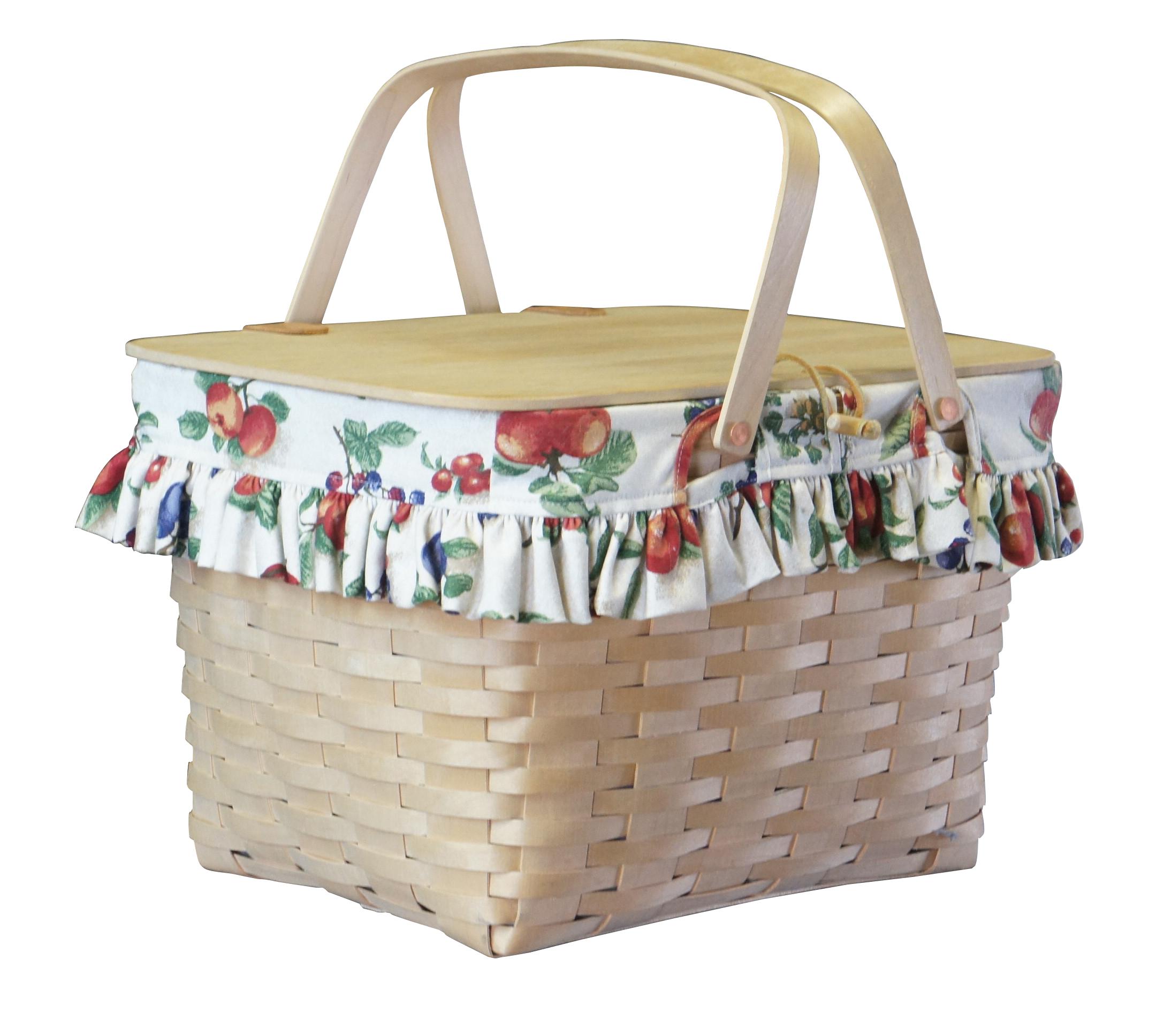 Longaberger woven hamper, circa 1998.  Features a floral liner, plastic insert and riser.  

DIMENSIONS

17