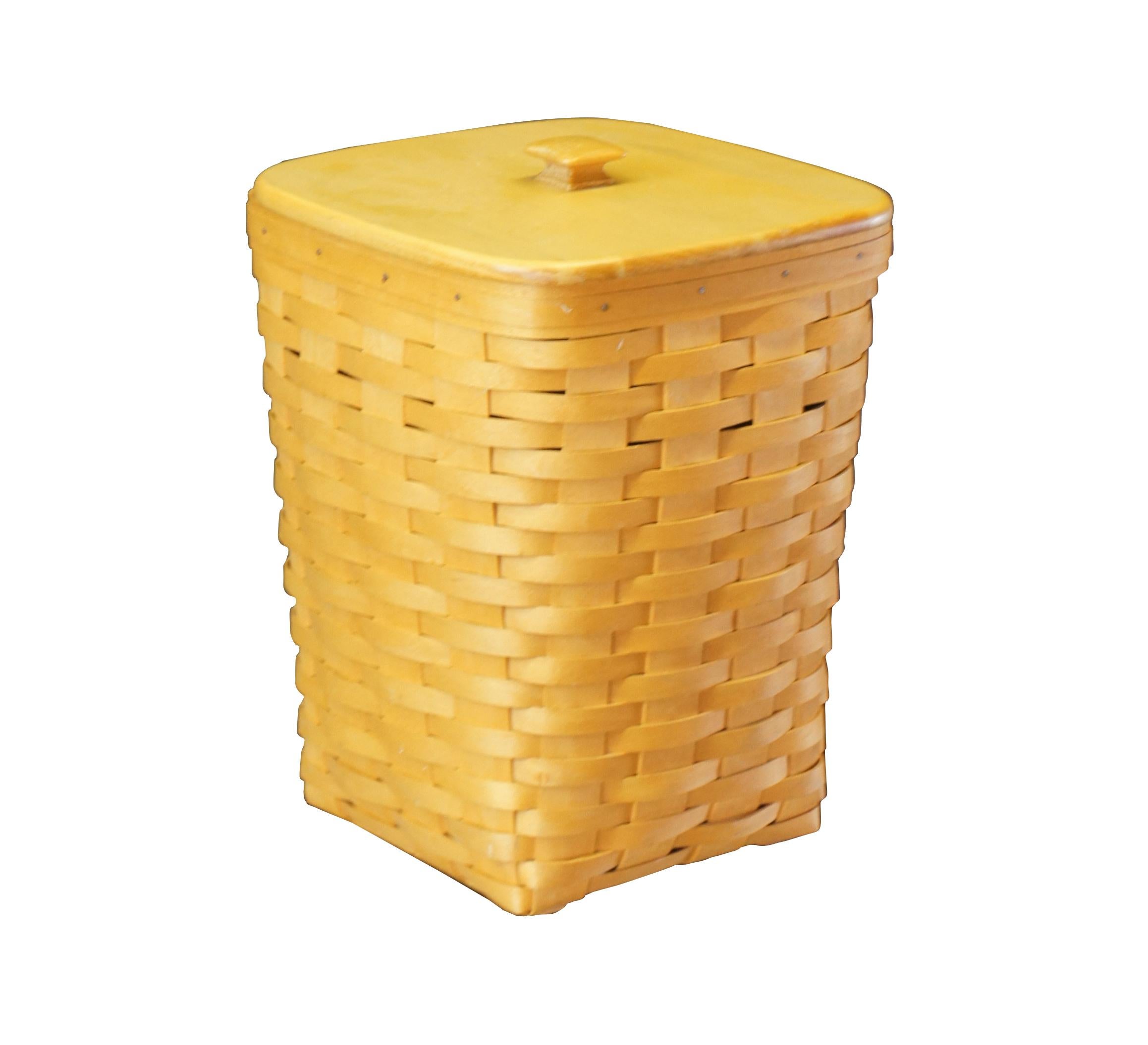 Longaberger woven trash can, circa 1999.  Features a plastic insert and lid.  

Dimensions: 
10