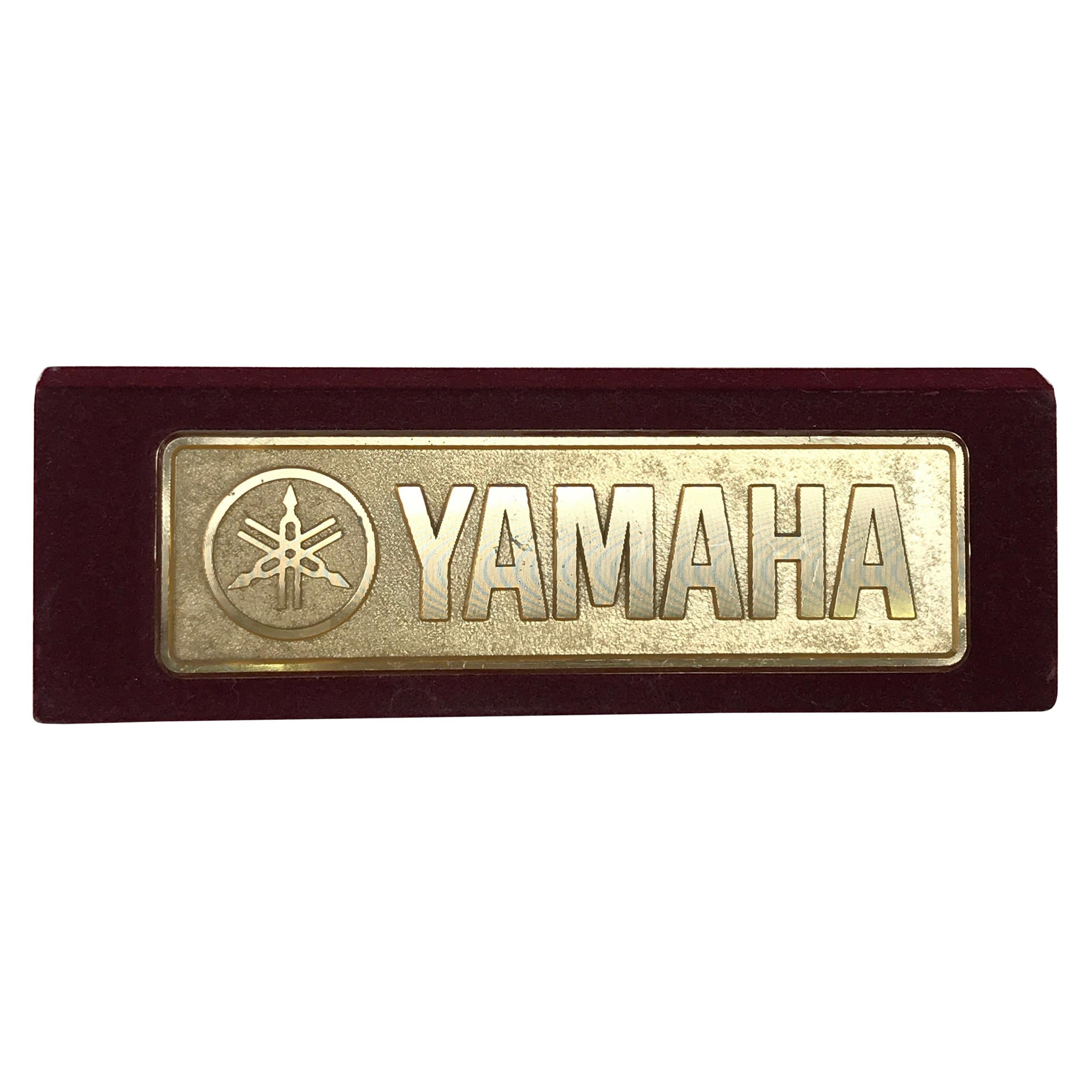 1990s Vintage Metal Yamaha Logo Display on Bordeaux Velvet For Sale