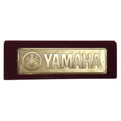 1990s Vintage Metal Yamaha Logo Display on Bordeaux Velvet