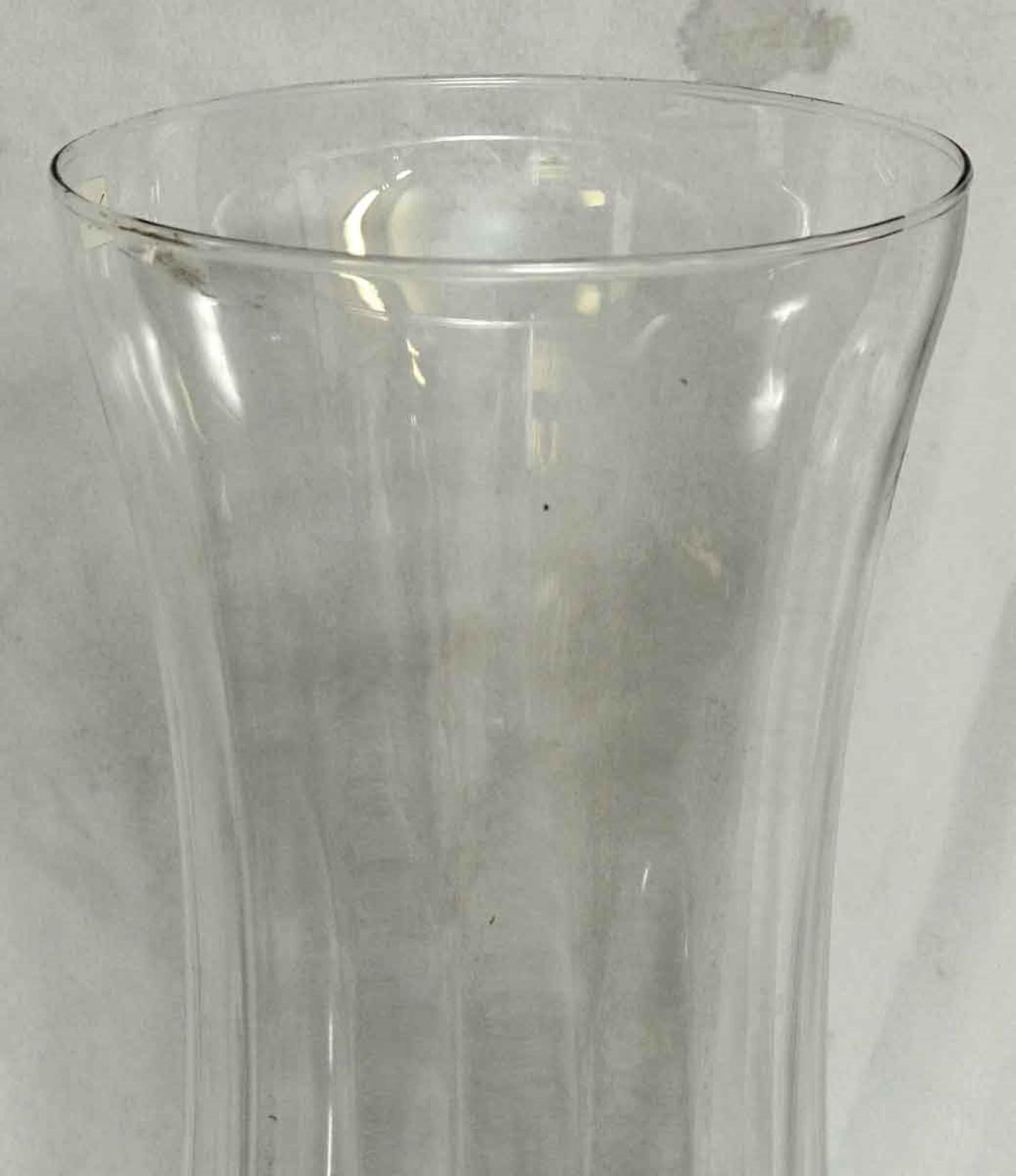Vintage 1990s clear European round curved glass vase. Done in a Mid-Century Modern style. Small quantity available at time of posting. Please inquire. Small quantity available at time of posting. Please inquire. Priced each. This can be seen at our