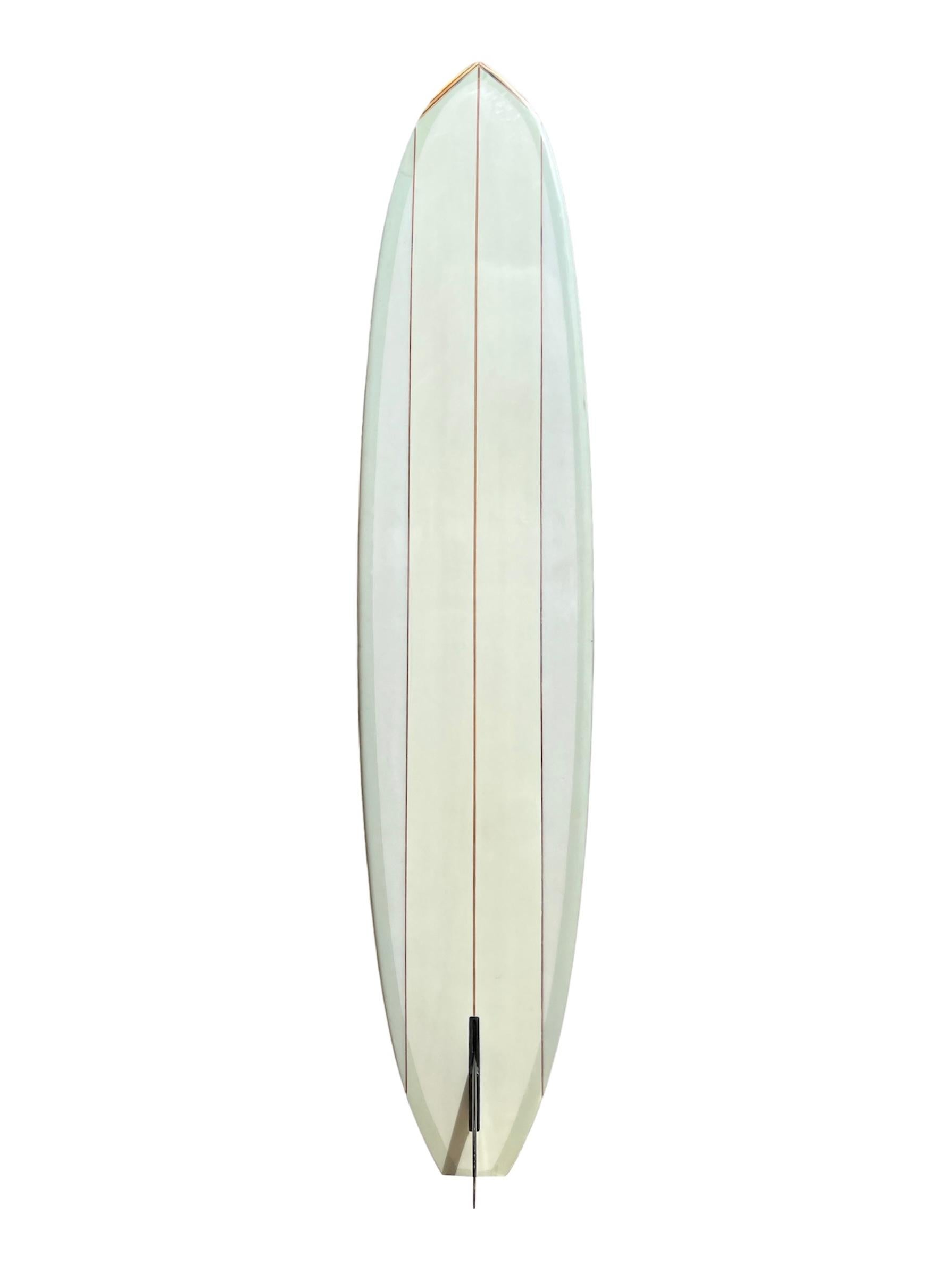 1990s Vintage Diffenderfer custom longboard made by late Mike Diffenderfer (1937-2002). Features 3 redwood stringers, wood nose and tail blocks, and pale green pinstriping. A wonderful example of a custom longboard shaped in Hawaii by the renowned
