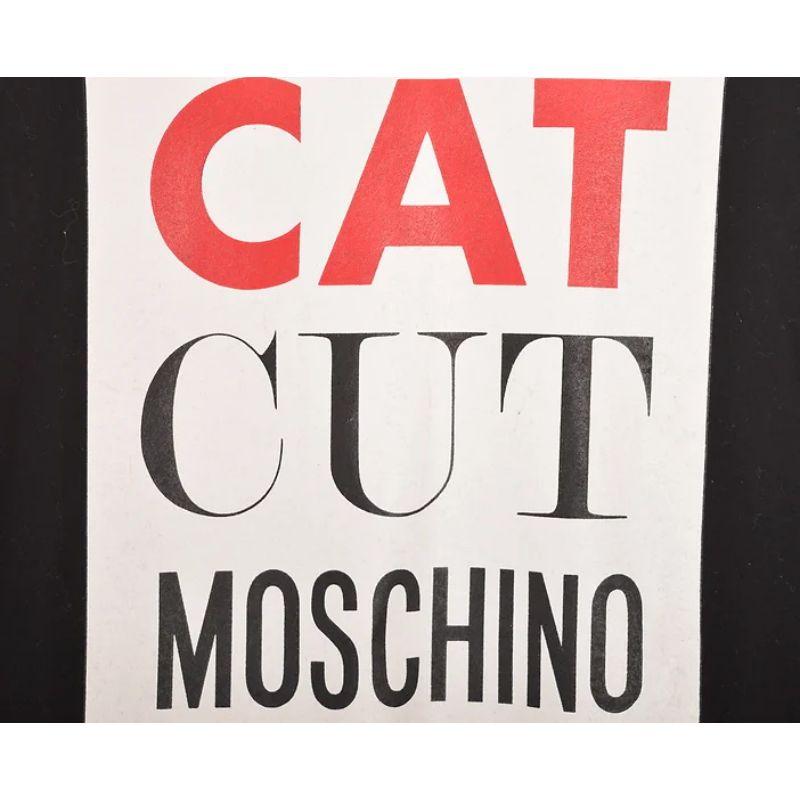 Loud, Vintage 1990's Moschino T-shirt, featuring Iconic 'CAT CUT' printed slogan on the front, Made for the Japanese market. 

Features:
Rounded neckline
Short sleeves
Loose fit

100% Cotton

Sizing measured in Inches: 
Pit to Pit: 20''
Nape to Hem: