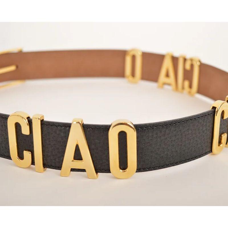 Charming Vintage 1990's Moschino 'Ciao Ciao Ciao' gold letter leather belt. 

A fun play on the classic 'MOSCHINO' letter belt with an Italian twist.

MADE IN ITALY !

Features:
'CIAO CIAO CIAO' Lettering
100% Leather

Sizing given in inches: Fits