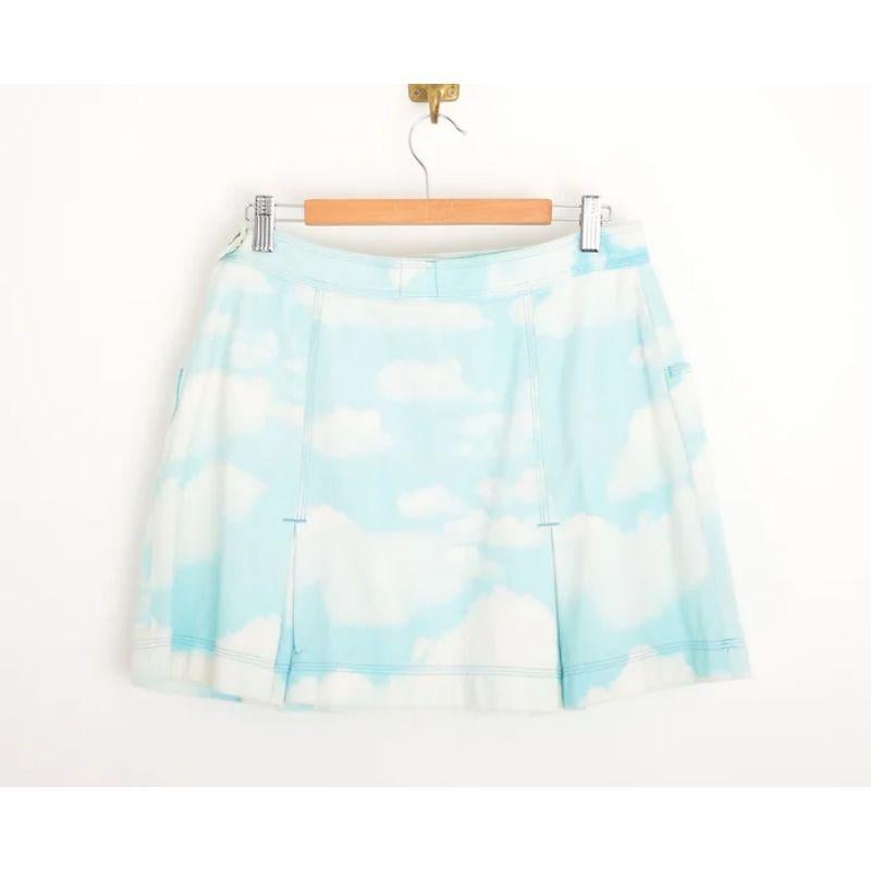 Superb Vintage Moschino 1990's high waisted Cloud print denim pleated mini-skirt.

MADE IN ITALY !

Features:
Side Zip Fasten closure
x2 front pocket design
High Waisted fit
Pleated hem detail

100% Cotton

Sizing: Waist: 30''
Length: