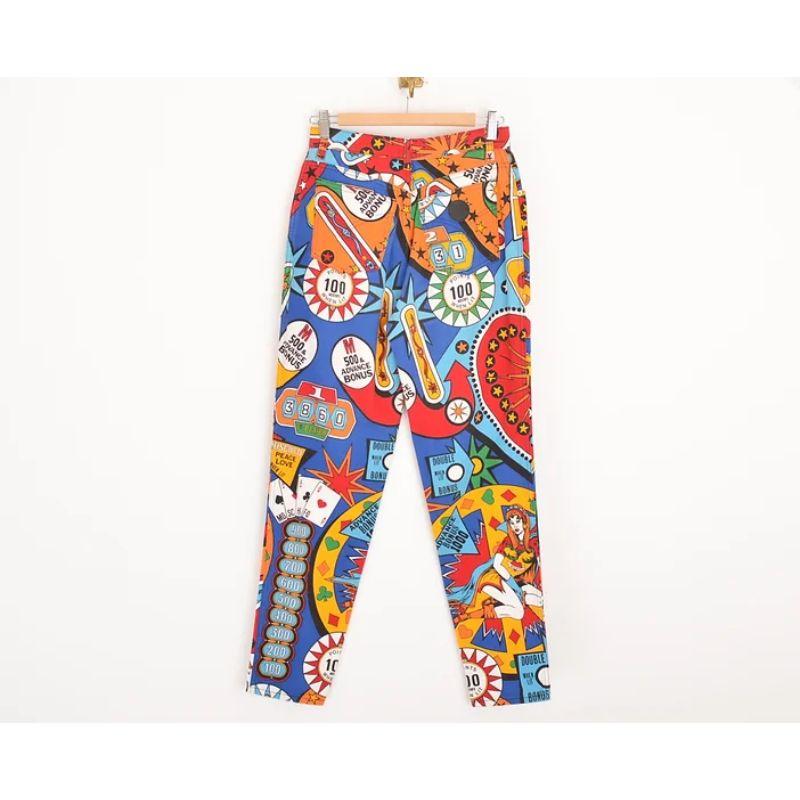 Vibrant, Vintage Early 1990's Moschino 'Pinball' patterned, high waisted Vegas themed trousers in bold primary colours. 

MADE IN ITALY !

Features:
High waisted fit
Classic x4 pocket design
Zip fasten

100% Cotton

Sizing given in inches: 
Waist: