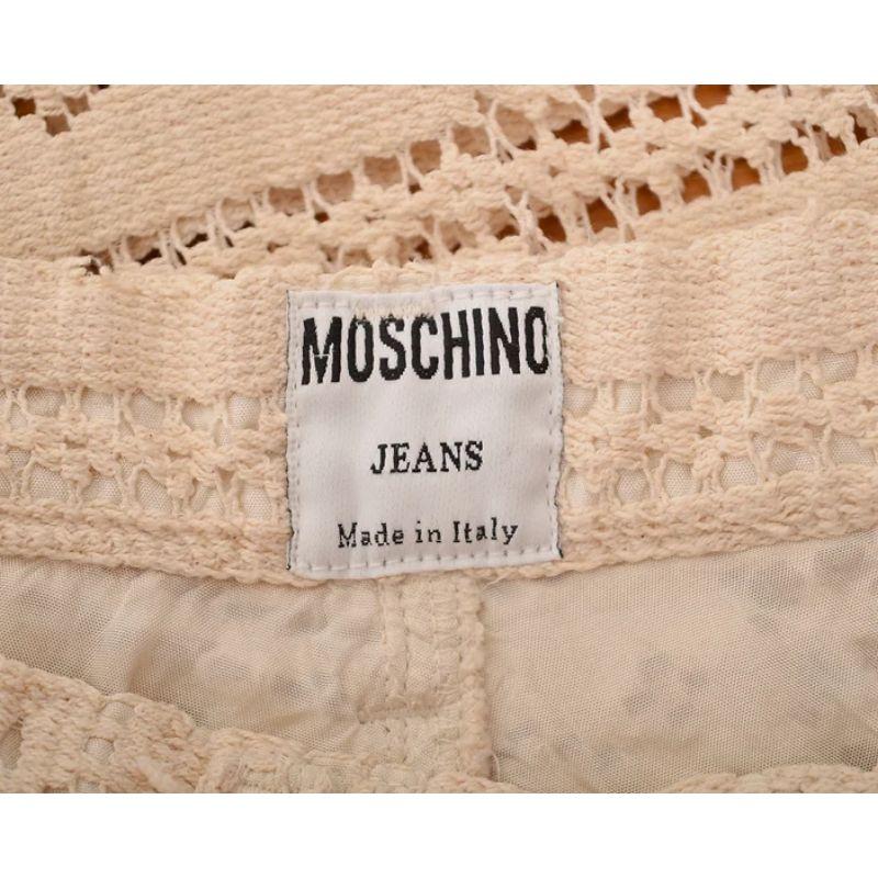 Lovely Vintage 1990's high waisted Moschino trousers in a cream crochet effect floral lace material with Gold metal hardware details. 

Made in Italy !

Features:
High waisted
Gold Flower shaped hardware
Zip crotch fasten
Classic x4 pocket