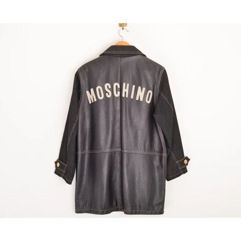 Chic & Fun, Vintage 1990's leather and dark denim coat by MOSCHINO, featuring large Moschino lettering across the back, with a vibrant, thick monochrome quilted signature lining. 

MADE IN ITALY.

Features:
Central line button fasten
Gold tone