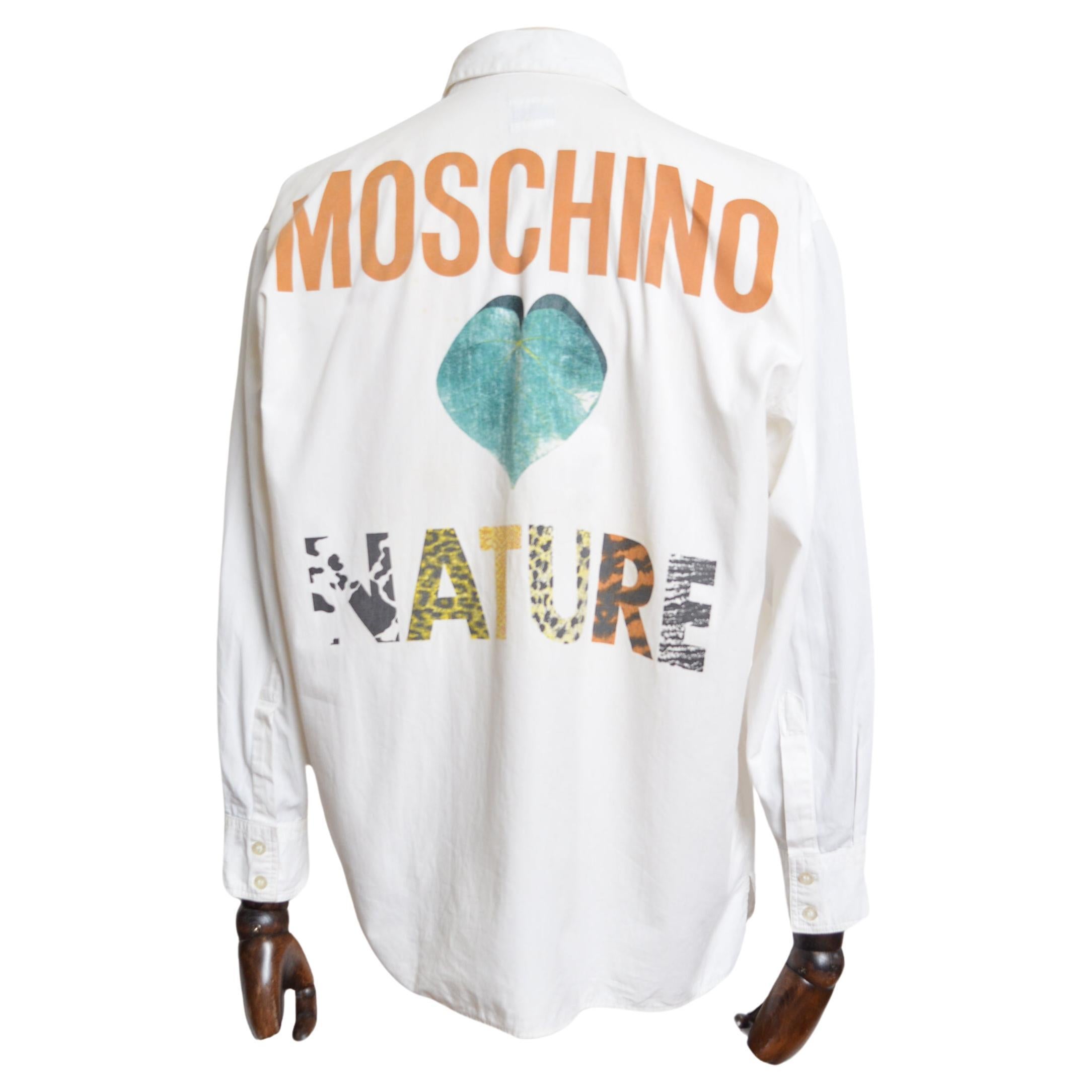 Early 1990's UK Garage Era 'MOSCHINO' Long sleeved Summer Shirt, crafted from a white printed Cotton with Large back hit across the reverse with the Slogan ' MOSCHINO NATURE'.

MADE IN ITALY.   

Features: Buttons down the front, Collar, Long