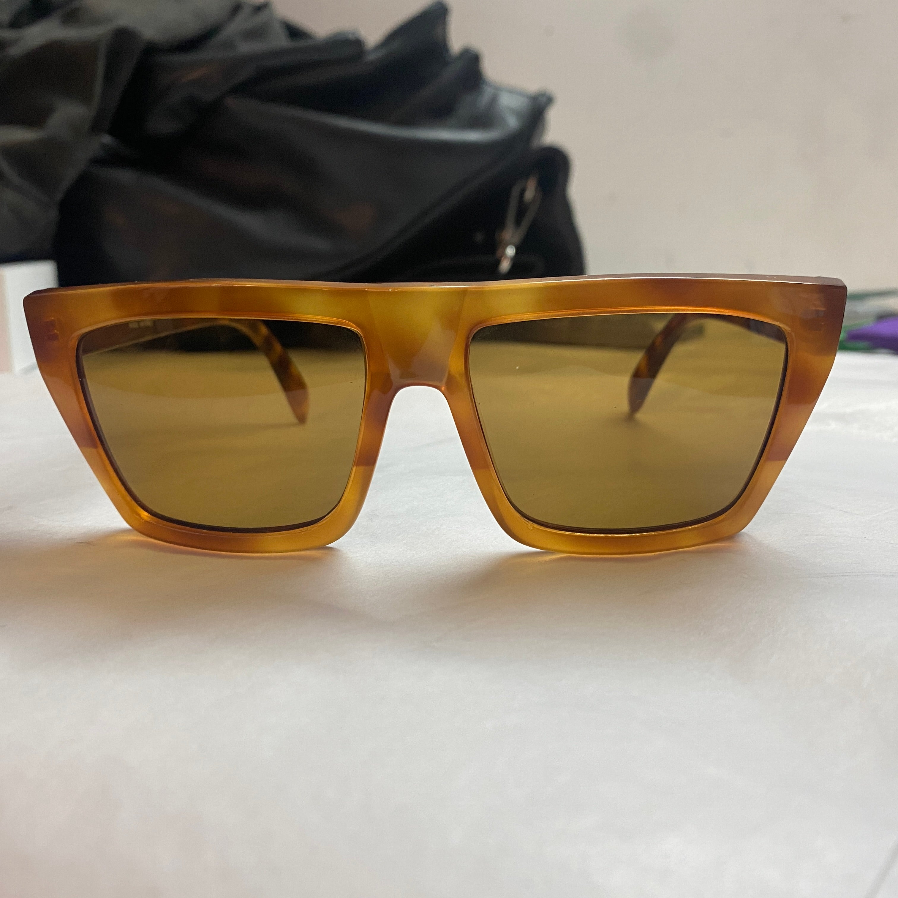 A fake tortoise oversized sunglasses designed by Gianni Versace and manufacutred in Italy in the Nineties, new lens, perfect condition of the sunglasses and superb vintage look makes them exclusive. 