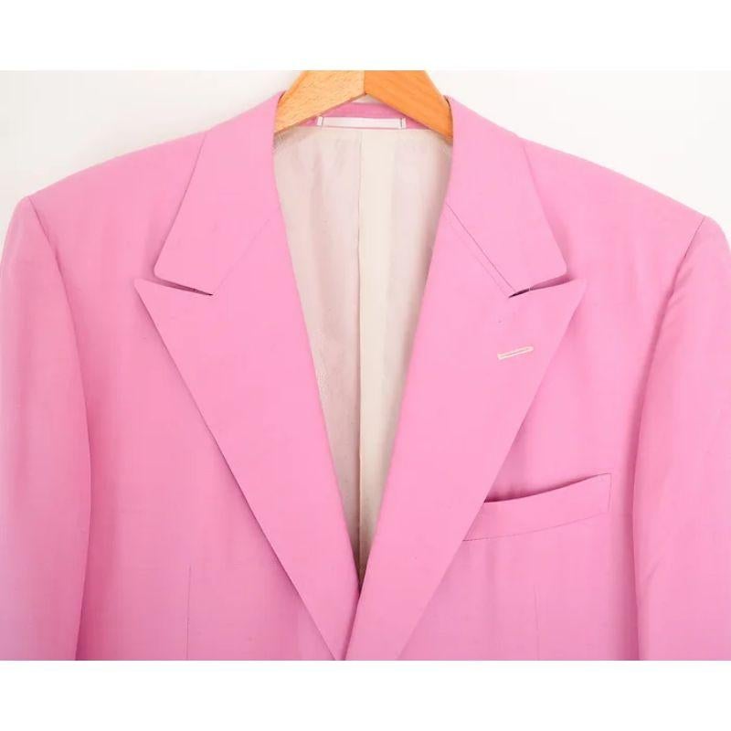 1990's Gianni Versace Couture oversized silk suit jacket in Organdy Pink, with Iconic gold Medusa buttons.

Features:
Hip pockets
Chest pocket
Fully lined interior
Medusa buttons

100% Silk

Sizing: Pit to Pit: 23''
Pit to Cuff: 18.5''
Nape to Hem: