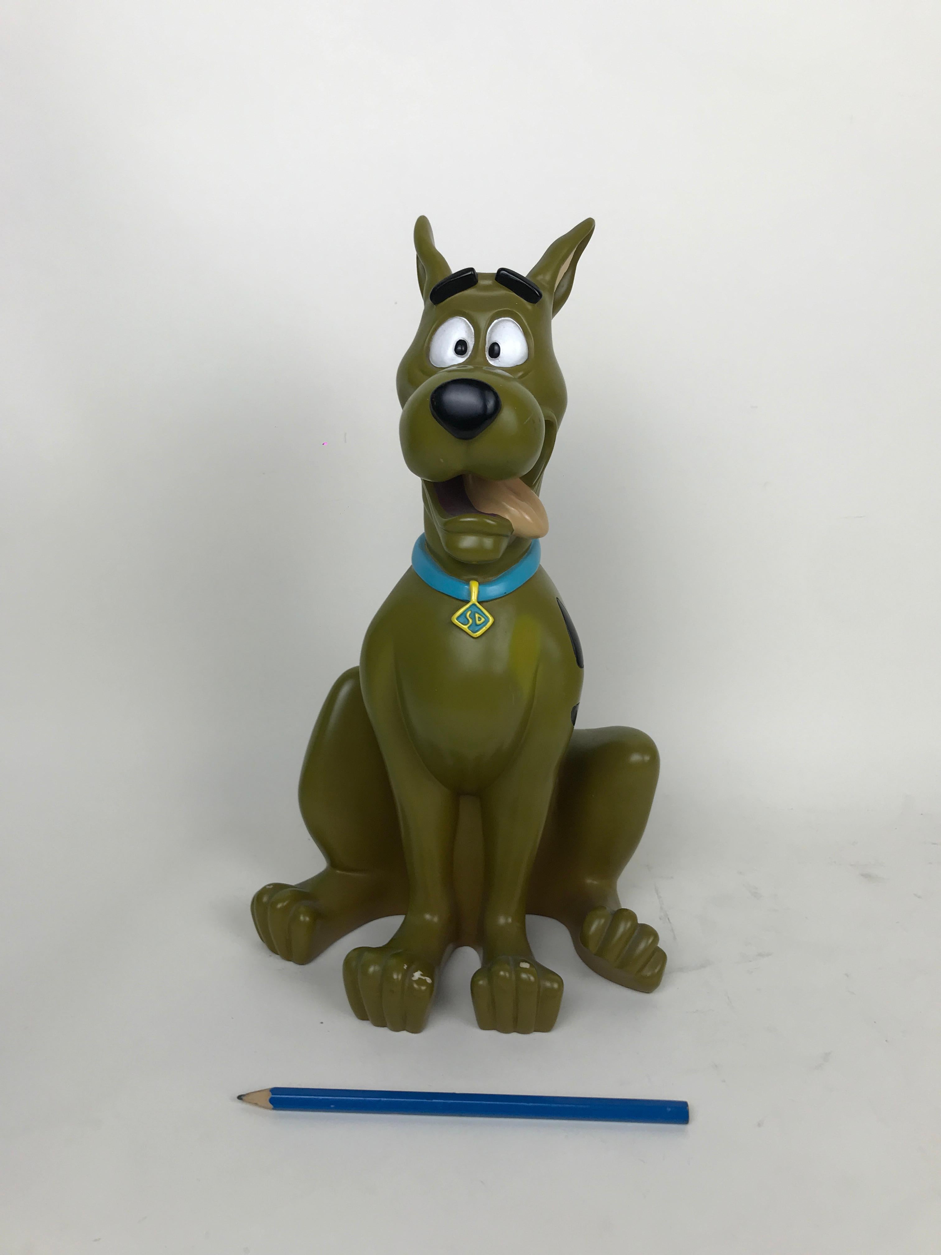 Vintage Scooby-Doo statue by Warner Bros Studio Store made in China in the 1998.

Marked on bottom:
Design Exclusive for Warner Bros Studio Store
Made in China TM & WB 1998
TM & Hanna-Barbera
Cartoon Network and logo
TM The Cartoon Network