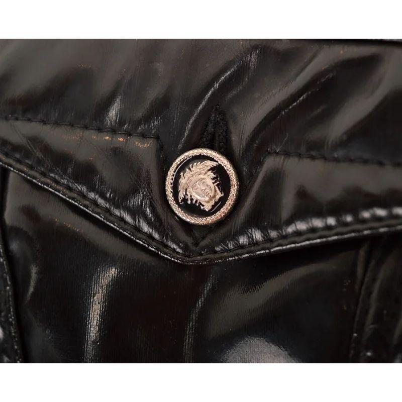 Vintage 1990s classic Versace cropped jacket in a glossy black latex fabric with iconic silver metal Medusa buttons and plush quilted lining. 

Features:
Chest pocket
Versace tab
Satin feel, quilted lining
Medusa buttons

75% Polyester / 25%