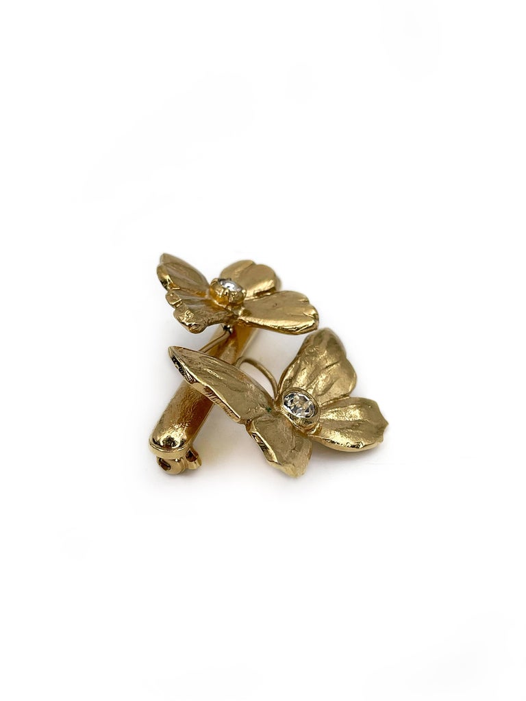 This is a beautiful two butterfly bar brooch designed by YSL in 1990’s. This piece is gold plated. It features clear rhinestones.

Signed: 