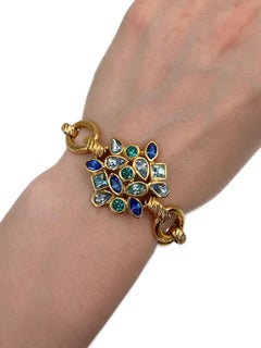 Bracelet vintage Yves Saint Laurent (YSL) des années 1990, à maillons dorés et cristaux bleus
